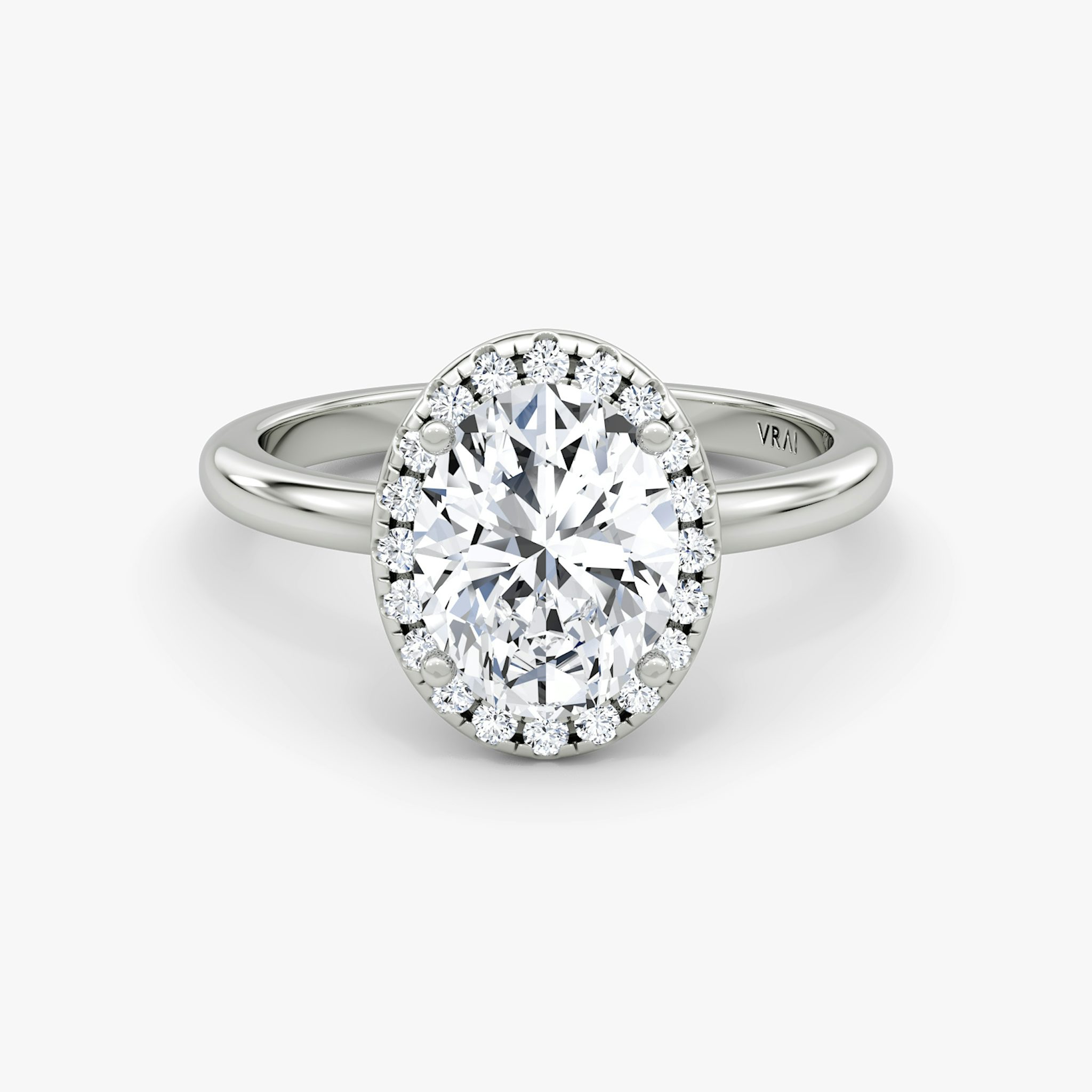 The Halo | Oval | Platinum | bandAccent: Plain | haloSize: original | diamondOrientation: vertical | caratWeight: other