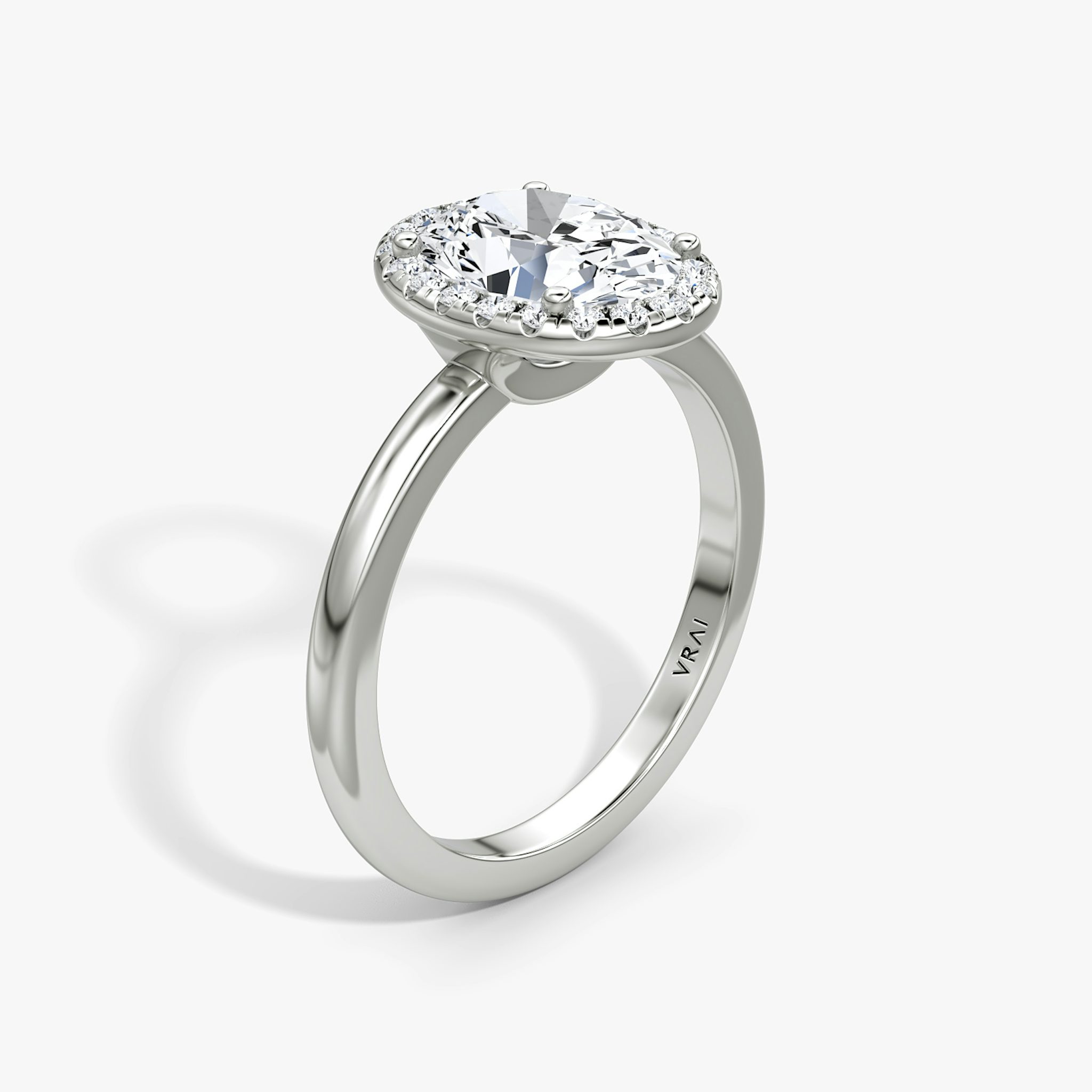 The Halo | Oval | Platinum | bandAccent: Plain | haloSize: original | diamondOrientation: vertical | caratWeight: other