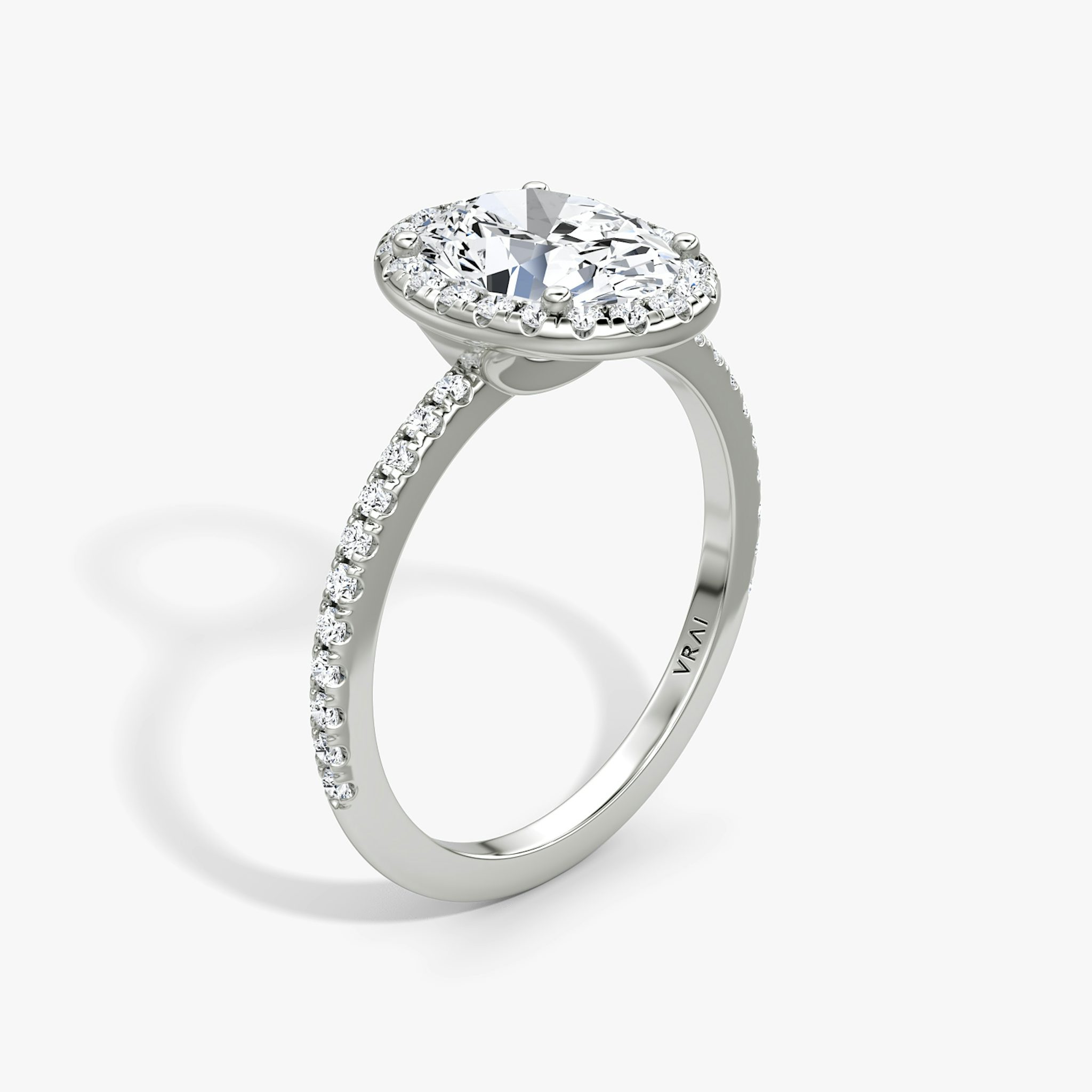 The Halo | Oval | 18k | White Gold | bandAccent: Pavé | haloSize: original | diamondOrientation: vertical | caratWeight: other