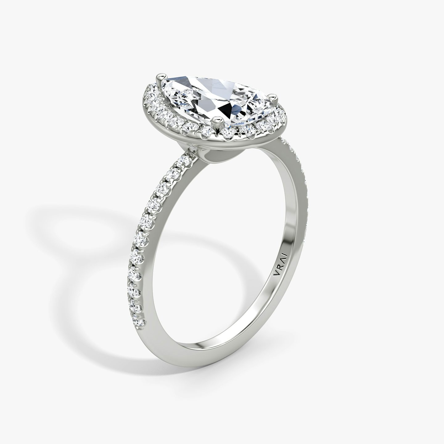 The Halo | Pear | Platinum | bandAccent: Pavé | haloSize: original | diamondOrientation: vertical | caratWeight: other