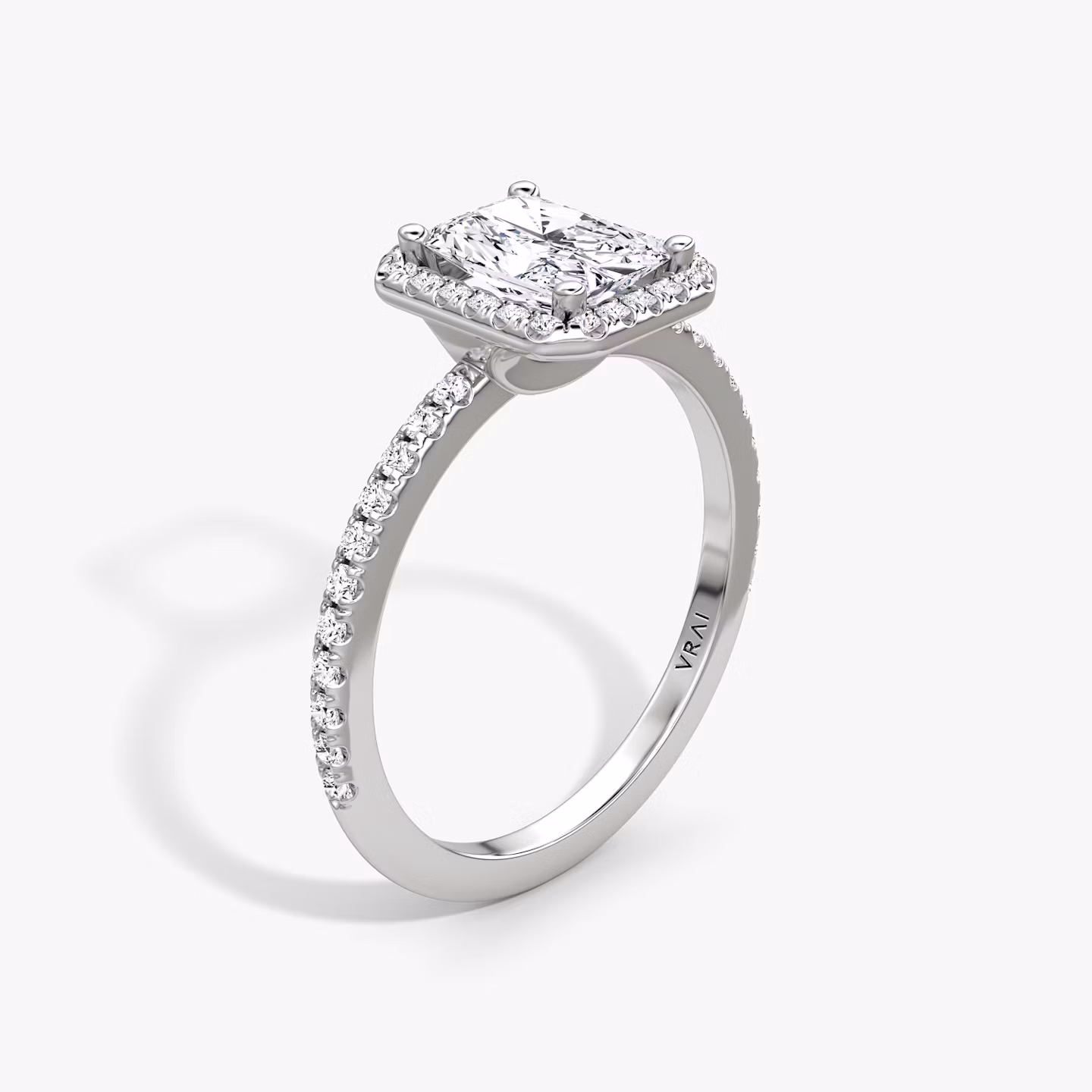 The Halo | Radiant | Platinum | bandAccent: Pavé | haloSize: original | diamondOrientation: vertical | caratWeight: other
