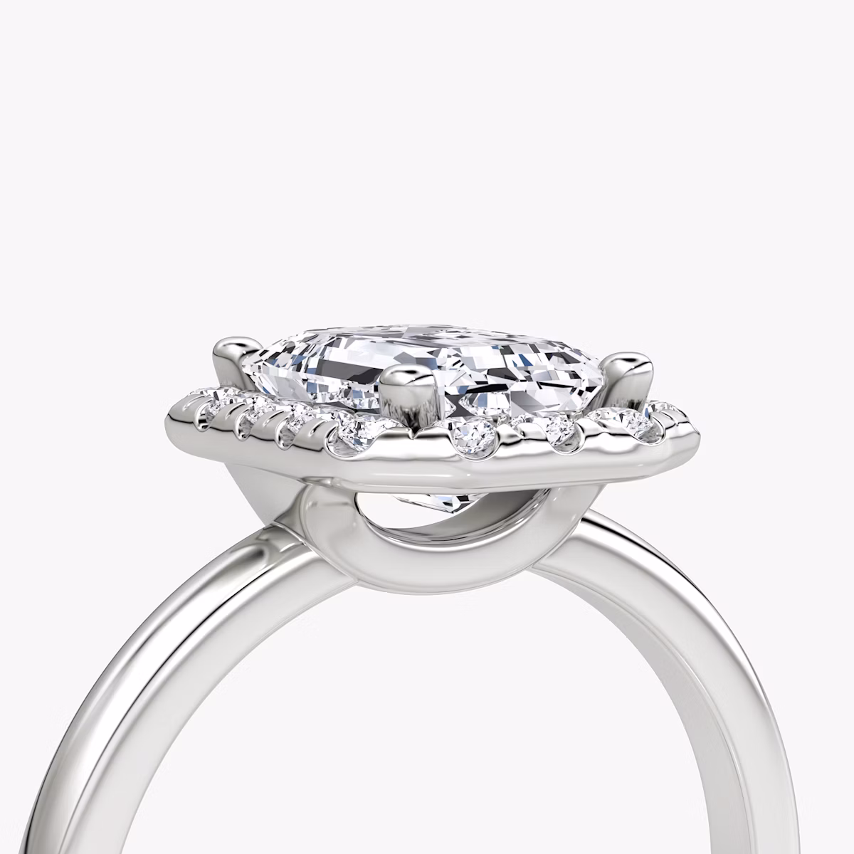 The Halo | Emerald | Platinum | bandAccent: Plain | haloSize: large | diamondOrientation: vertical | caratWeight: other
