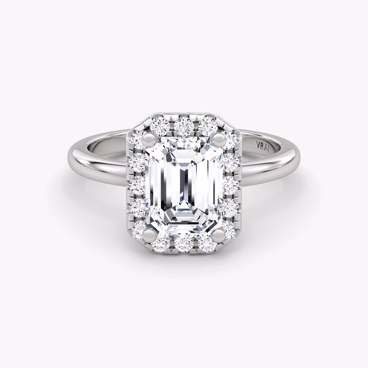 The Halo | Emerald | Platinum | bandAccent: Plain | haloSize: large | diamondOrientation: vertical | caratWeight: other