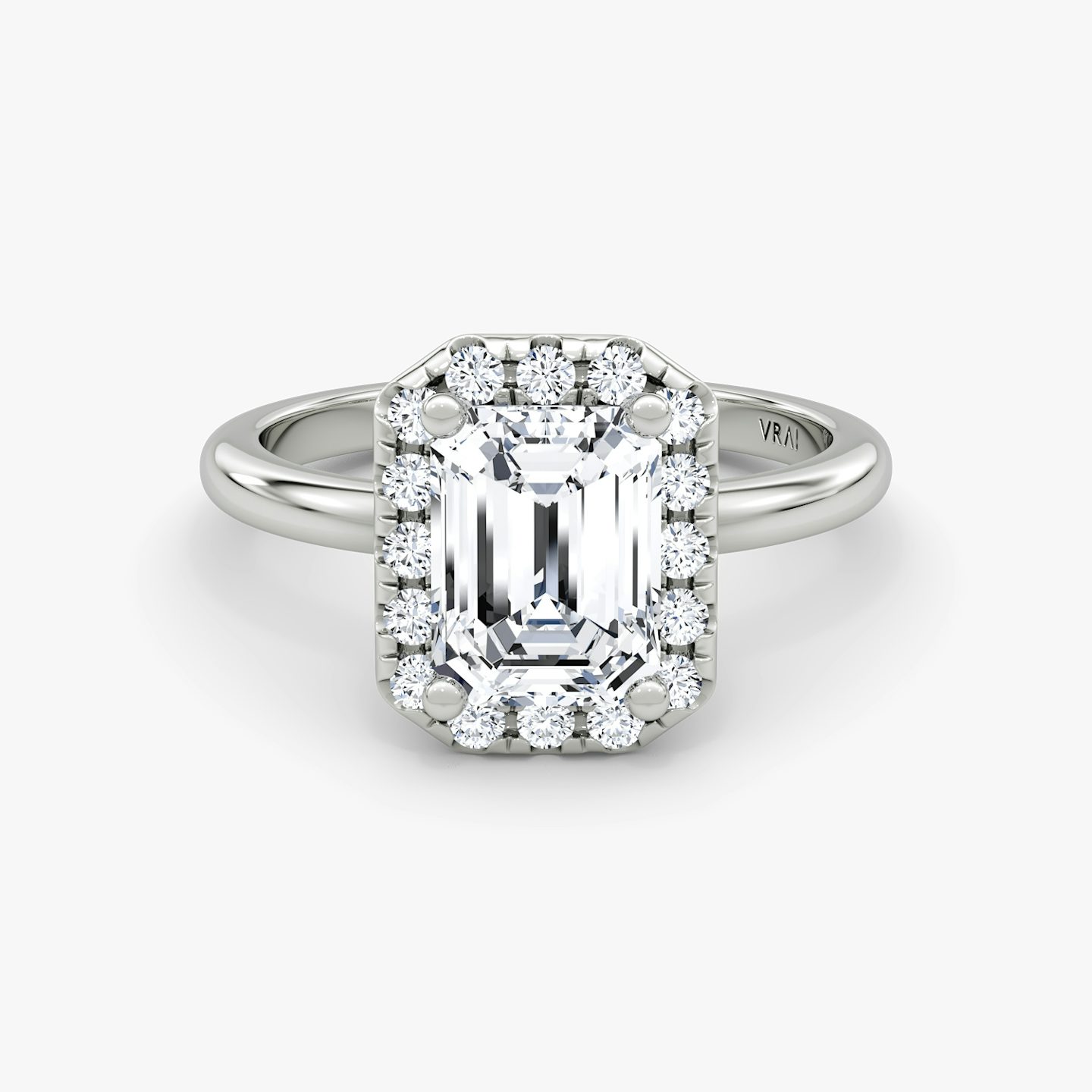 The Halo | Emerald | Platinum | bandAccent: Plain | haloSize: large | diamondOrientation: vertical | caratWeight: other