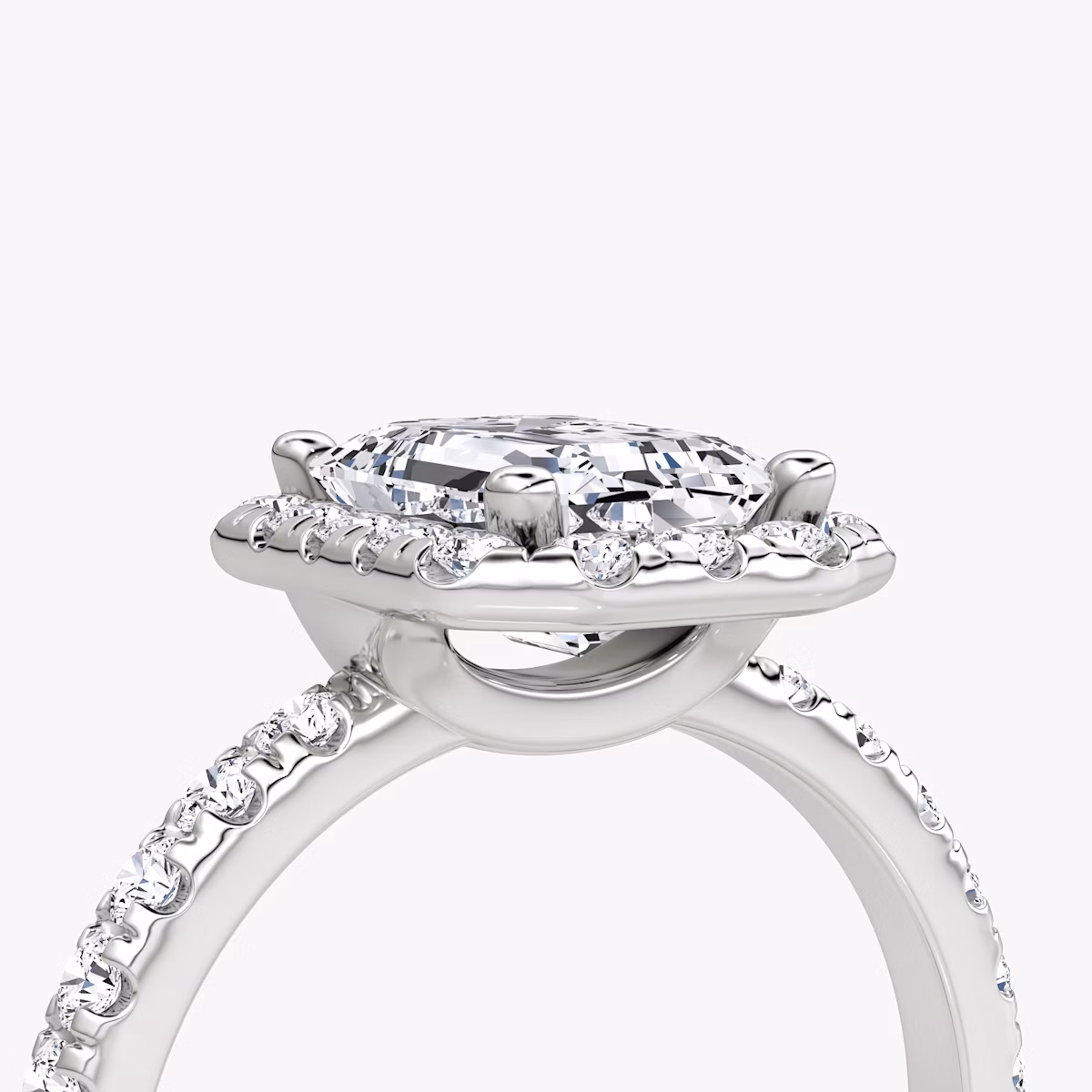 The Halo | Emerald | Platinum | bandAccent: Pavé | haloSize: large | diamondOrientation: vertical | caratWeight: other