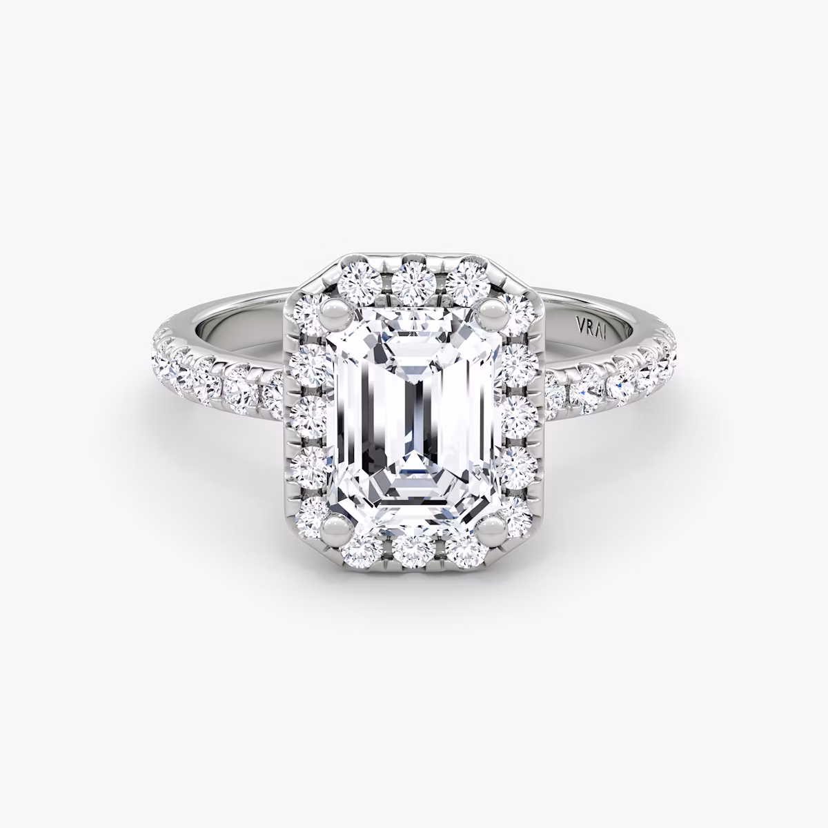 The Halo | Emerald | Platinum | bandAccent: Pavé | haloSize: large | diamondOrientation: vertical | caratWeight: other