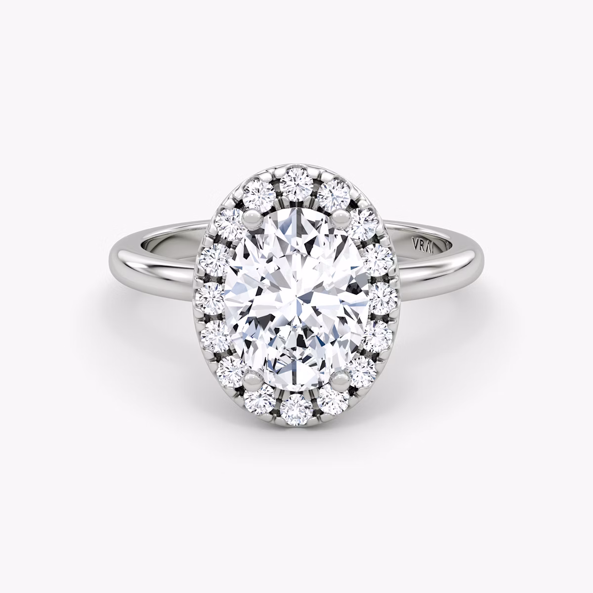 The Halo | Oval | Platinum | bandAccent: Plain | haloSize: large | diamondOrientation: vertical | caratWeight: other