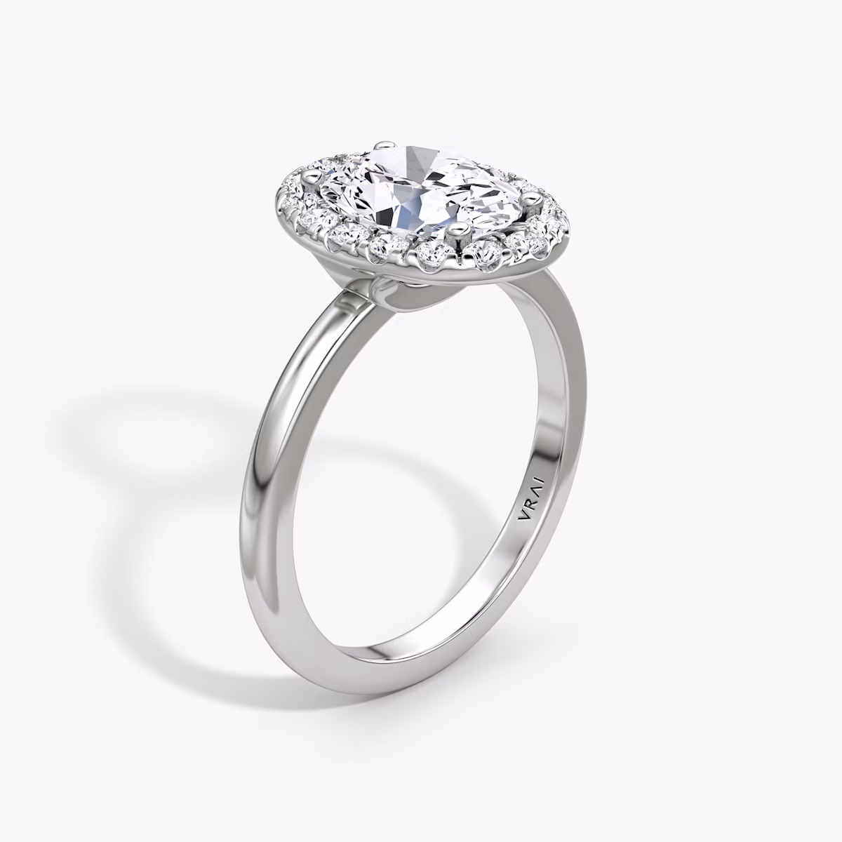 The Halo | Oval | Platinum | bandAccent: Plain | haloSize: large | diamondOrientation: vertical | caratWeight: other