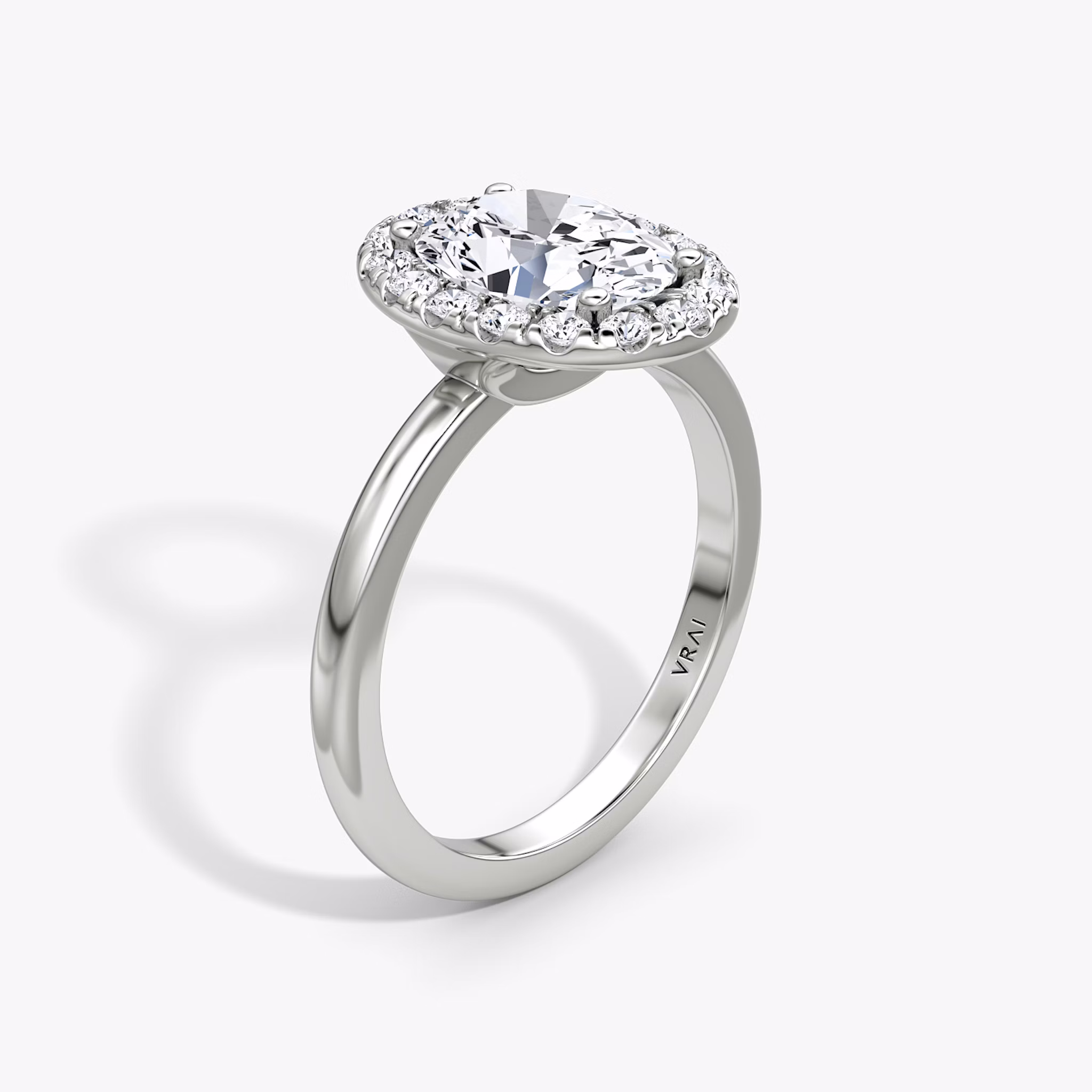 The Halo | Oval | 18k | White Gold | bandAccent: Plain | haloSize: large | diamondOrientation: vertical | caratWeight: other