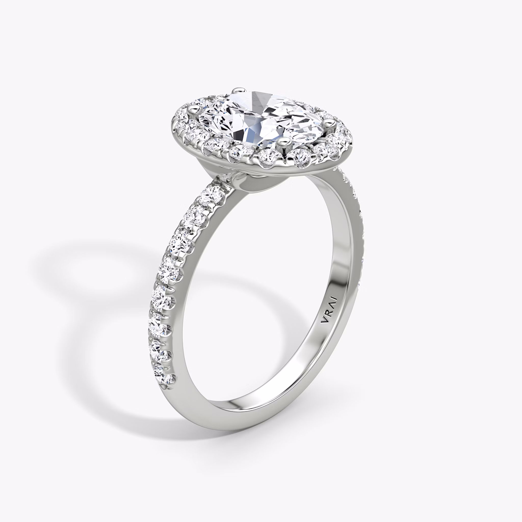 The Halo | Oval | 18k | White Gold | bandAccent: Pavé | haloSize: large | diamondOrientation: vertical | caratWeight: other