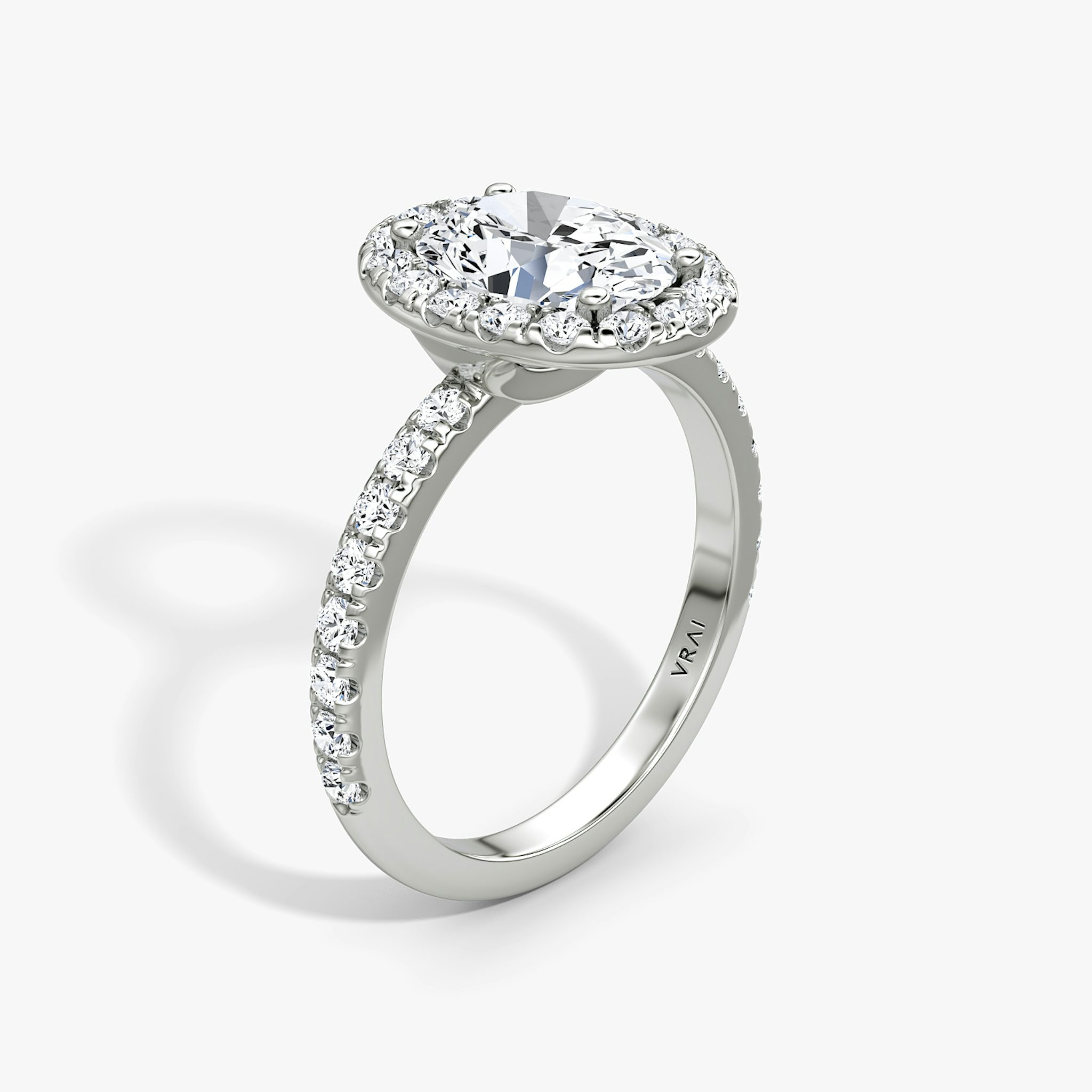 The Halo | Oval | 18k | White Gold | bandAccent: Pavé | haloSize: large | diamondOrientation: vertical | caratWeight: other