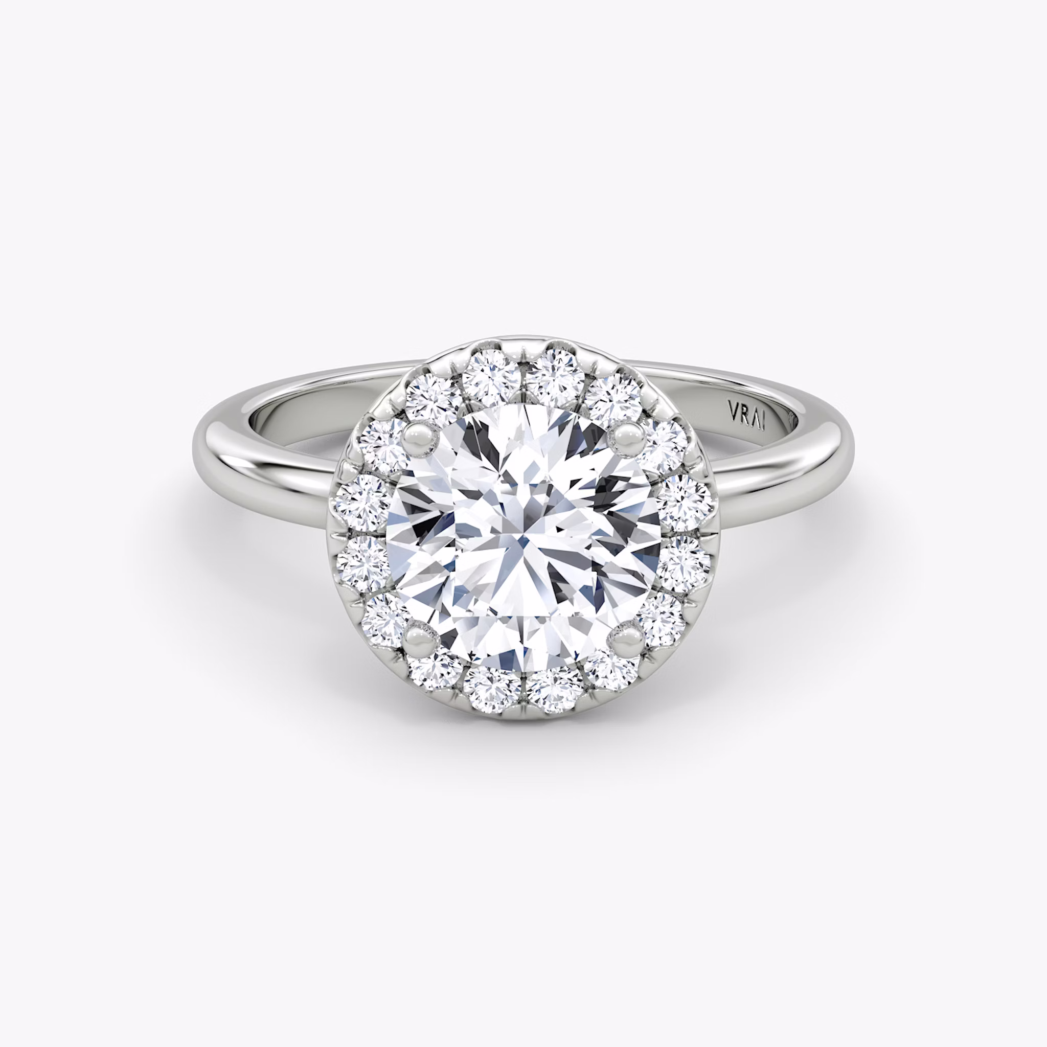 The Halo | Round Brilliant | Platinum | bandAccent: Plain | caratWeight: other | haloSize: large | diamondOrientation: vertical