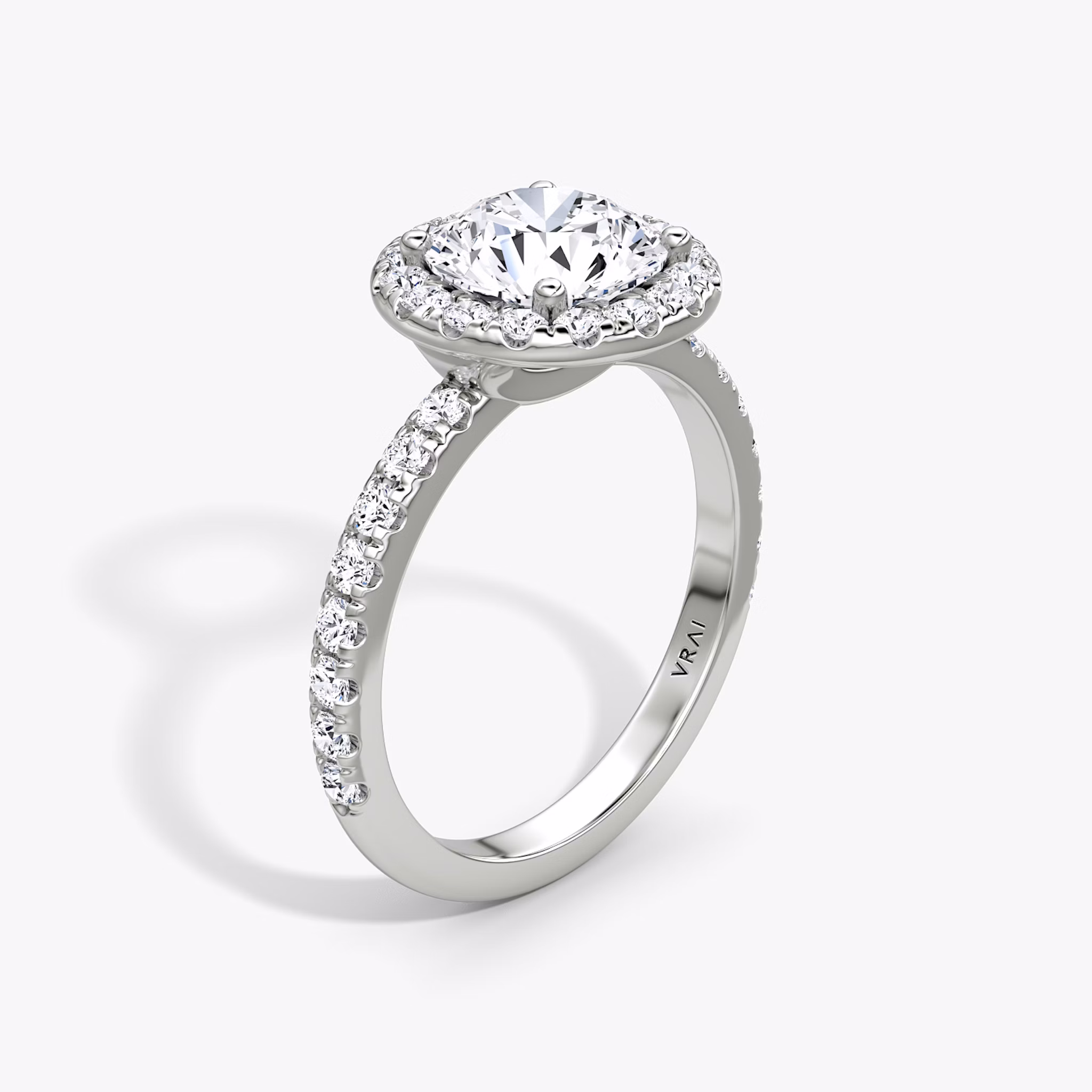 The Halo | Round Brilliant | Platinum | bandAccent: Pavé | caratWeight: 1.5ct | haloSize: large | diamondOrientation: vertical