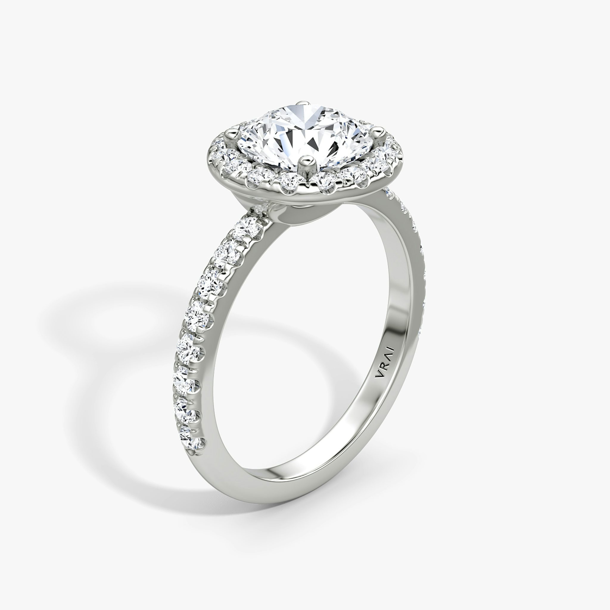 The Halo | Round Brilliant | Platinum | bandAccent: Pavé | caratWeight: 1.5ct | haloSize: large | diamondOrientation: vertical