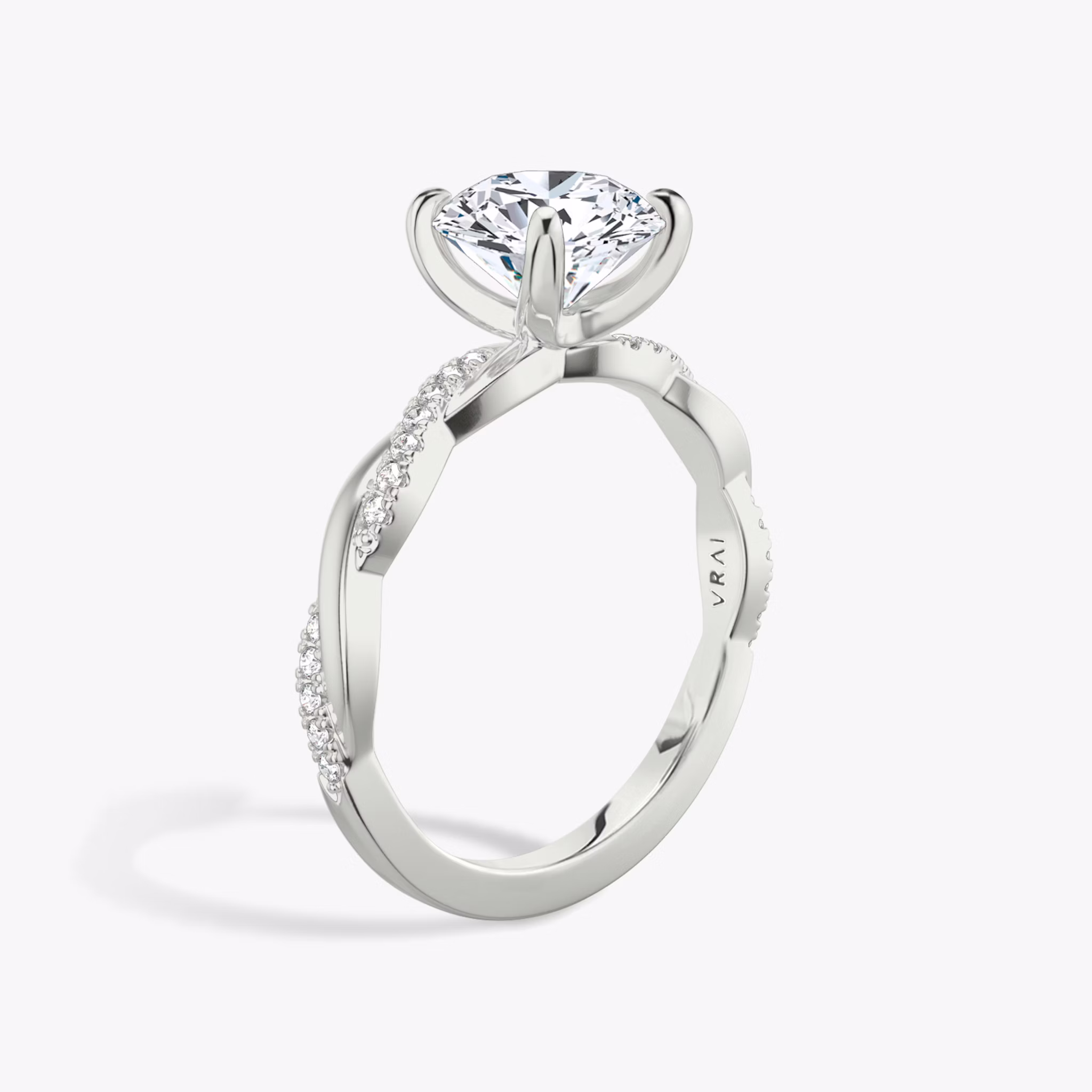 The Twisted Classic | Round Brilliant | 18k | White Gold | bandAccent: Pavé | caratWeight: other | diamondOrientation: vertical
