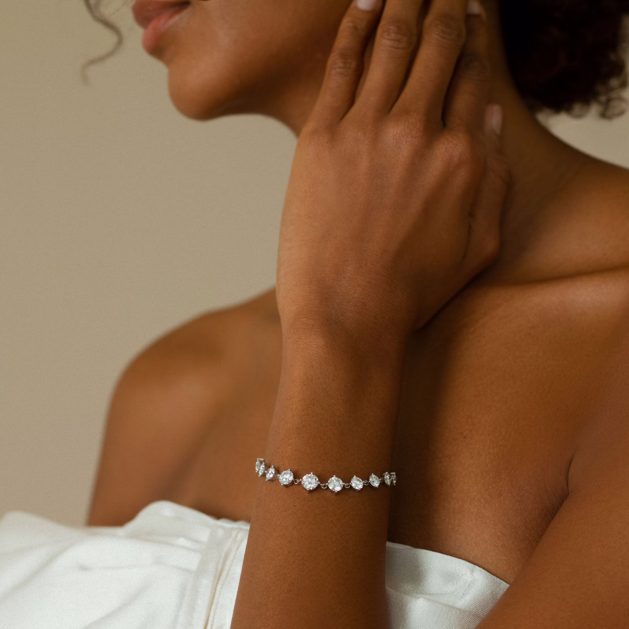 Model wearing a diamond tennis bracelet, styled on the wrist to showcase fit, sparkle, and everyday elegance.