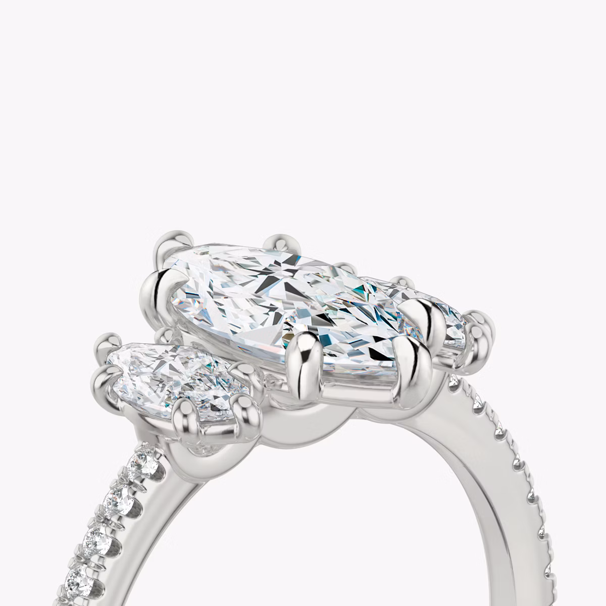 The Three Stone | Marquise | 18k | White Gold | bandAccent: Pavé | sideStoneCarat: 0.25ct | sideStoneShape: Marquise | diamondOrientation: vertical | caratWeight: other