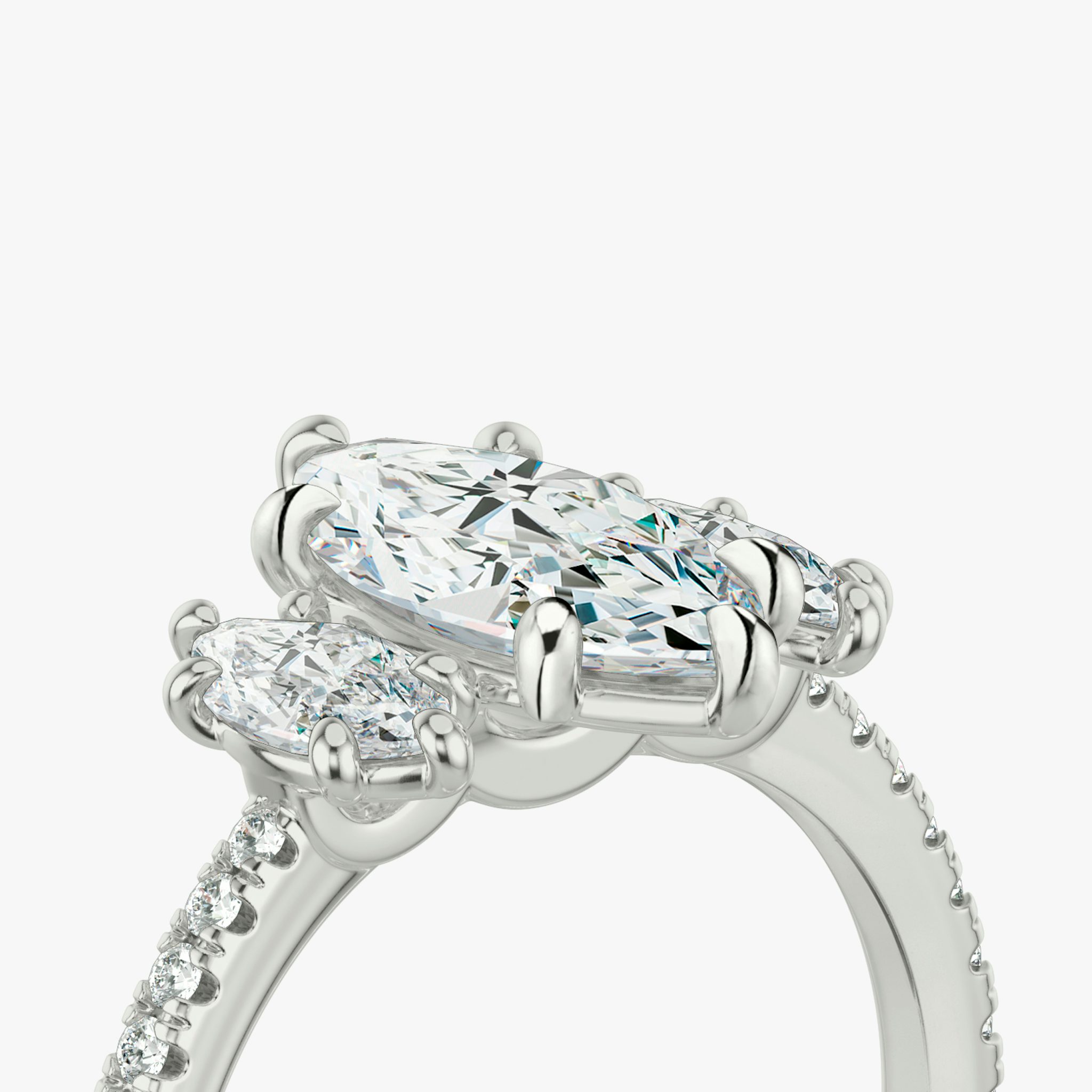 The Three Stone | Marquise | Platinum | bandAccent: Pavé | sideStoneCarat: 0.25ct | sideStoneShape: Marquise | diamondOrientation: vertical | caratWeight: other