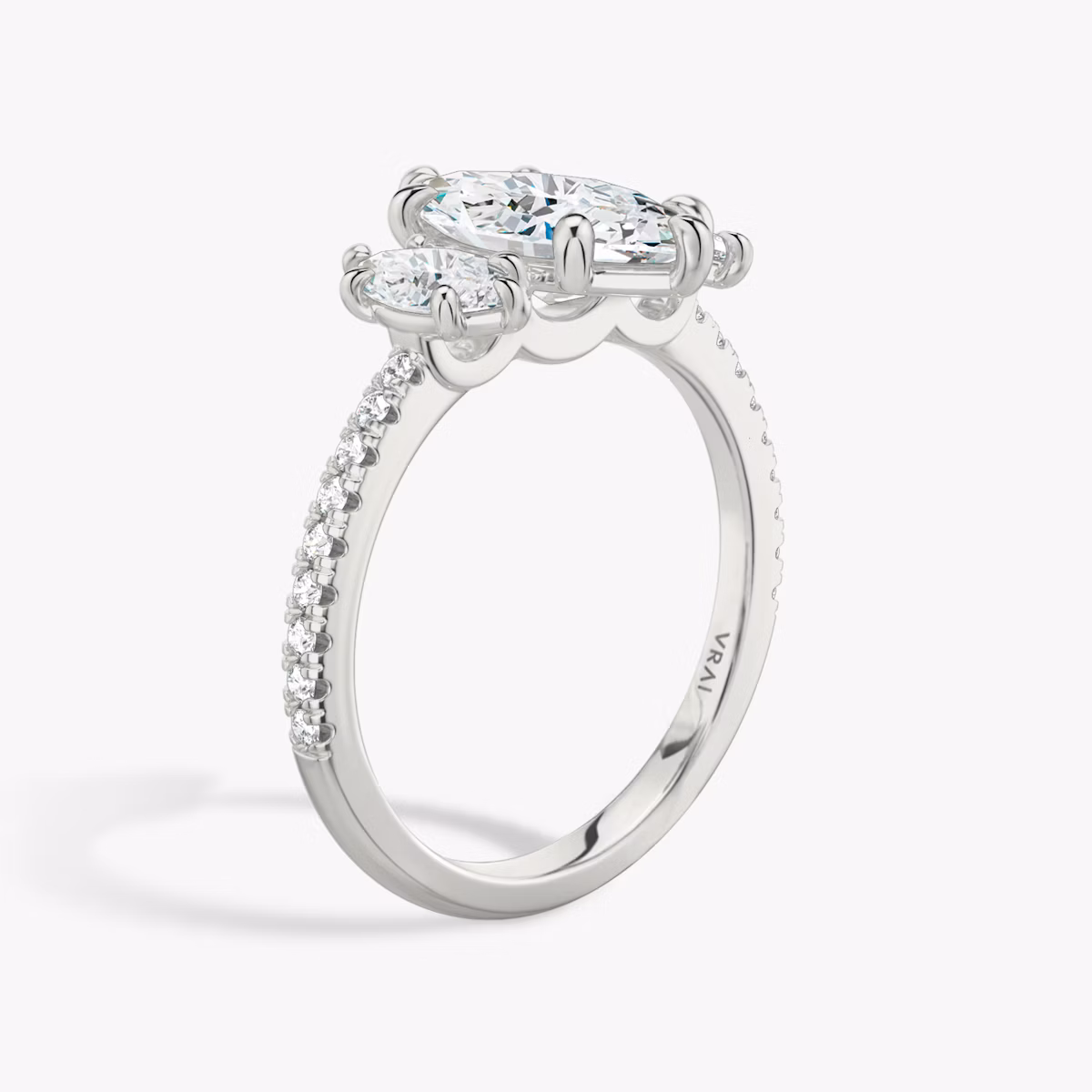 The Three Stone | Marquise | 18k | White Gold | bandAccent: Pavé | sideStoneCarat: 0.25ct | sideStoneShape: Marquise | diamondOrientation: vertical | caratWeight: other
