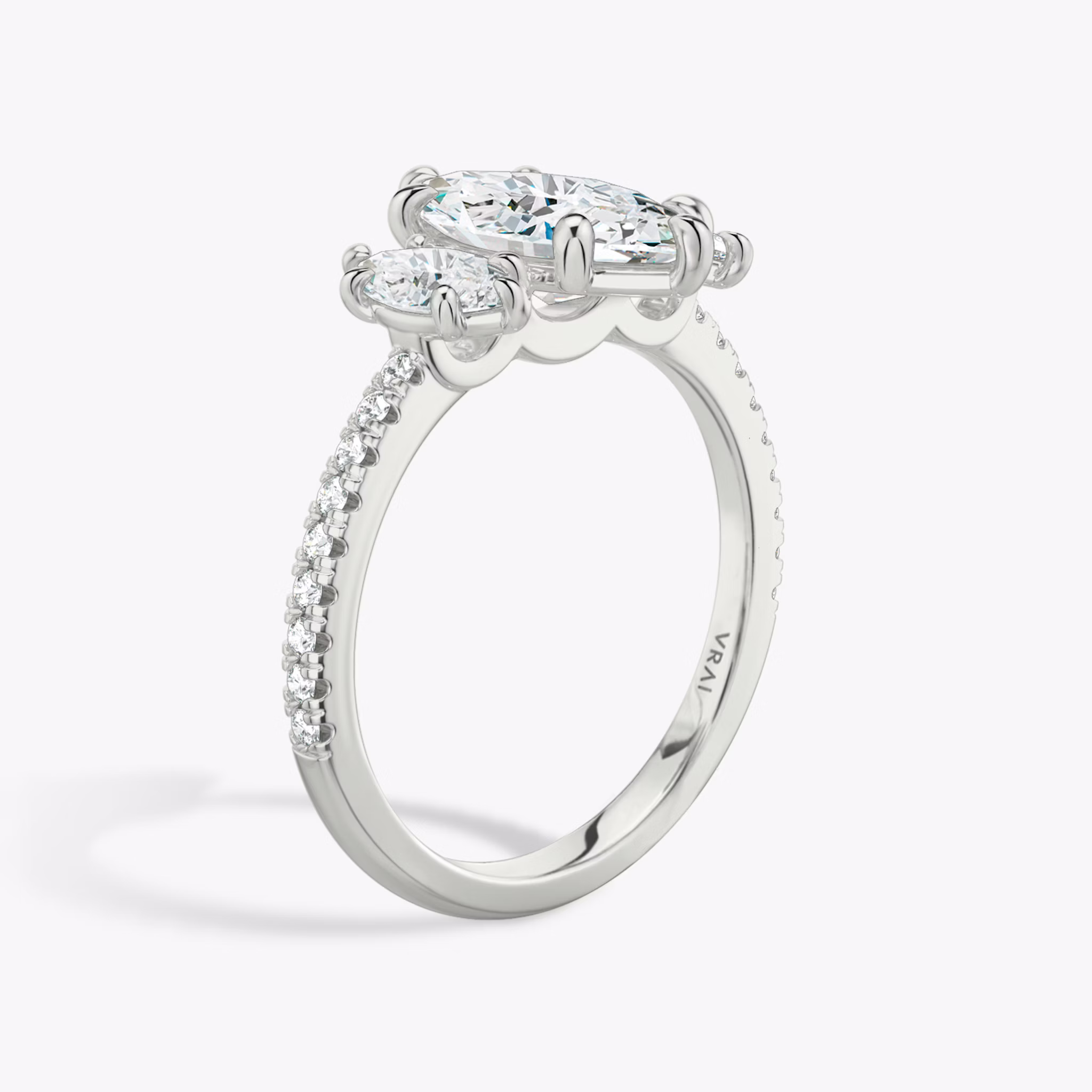 The Three Stone | Marquise | Platinum | bandAccent: Pavé | sideStoneCarat: 0.25ct | sideStoneShape: Marquise | diamondOrientation: vertical | caratWeight: other