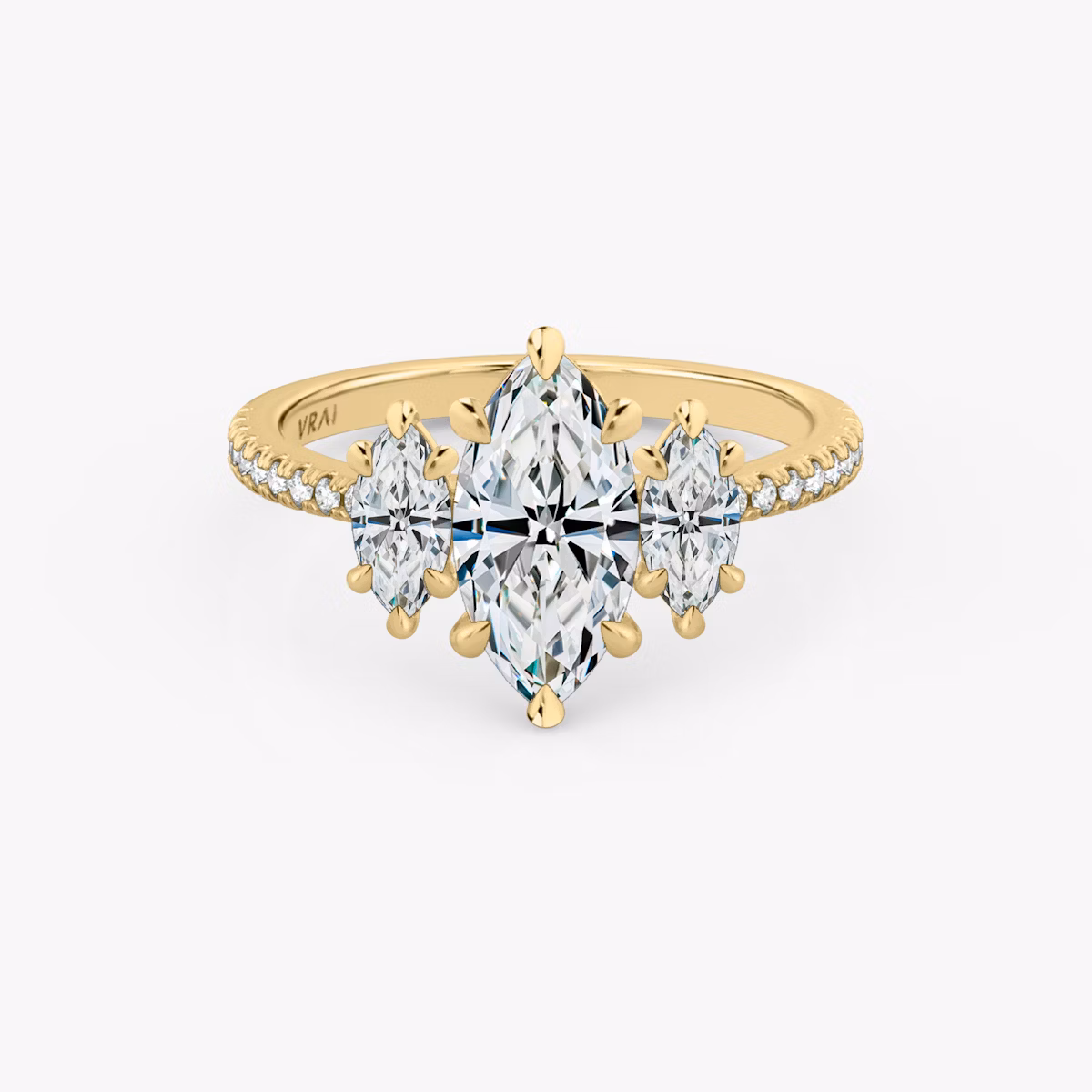 The Three Stone | Marquise | 18k | Yellow Gold | bandAccent: Pavé | sideStoneCarat: 0.25ct | sideStoneShape: Marquise | diamondOrientation: vertical | caratWeight: other
