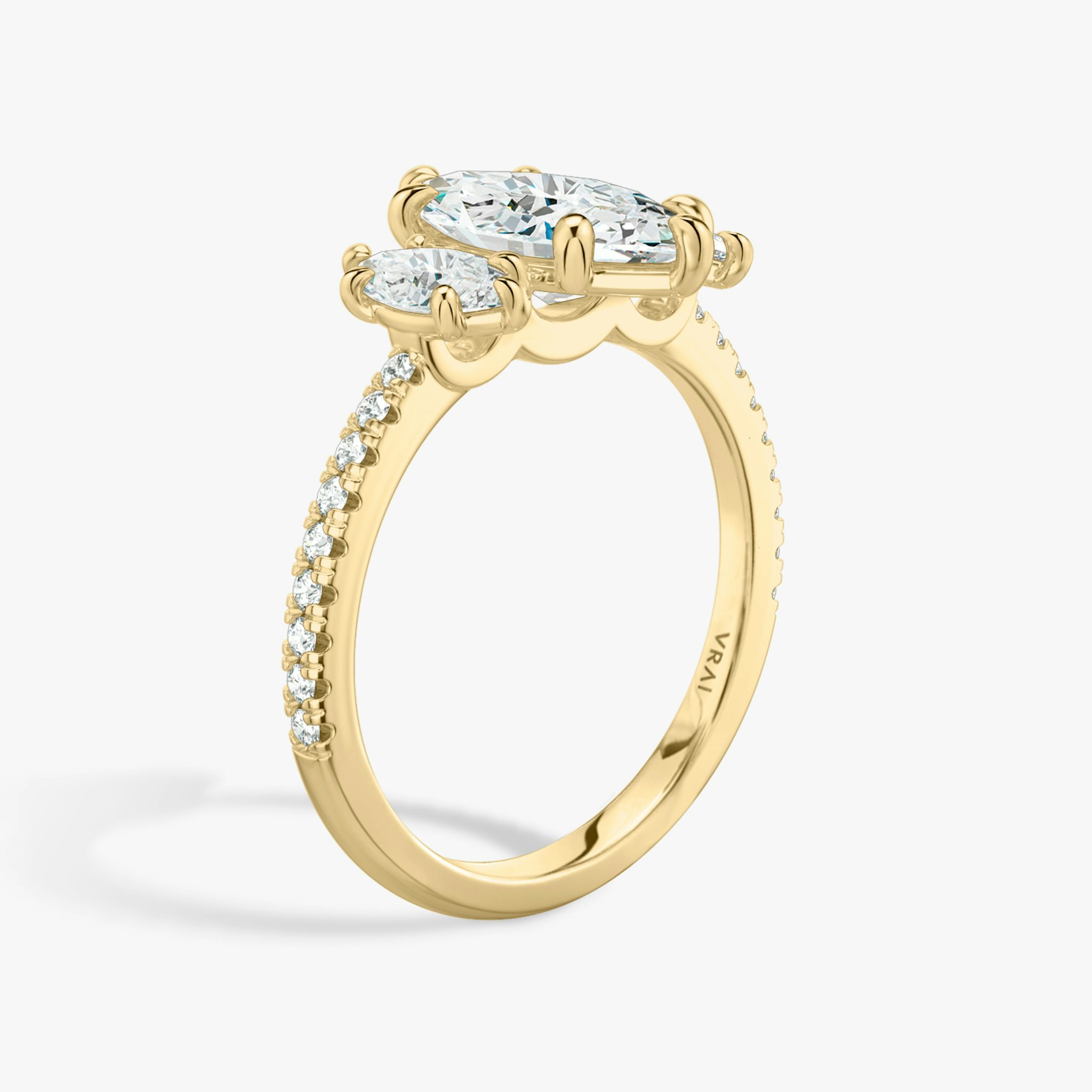 The Three Stone | Marquise | 18k | Yellow Gold | bandAccent: Pavé | sideStoneCarat: 0.25ct | sideStoneShape: Marquise | diamondOrientation: vertical | caratWeight: other