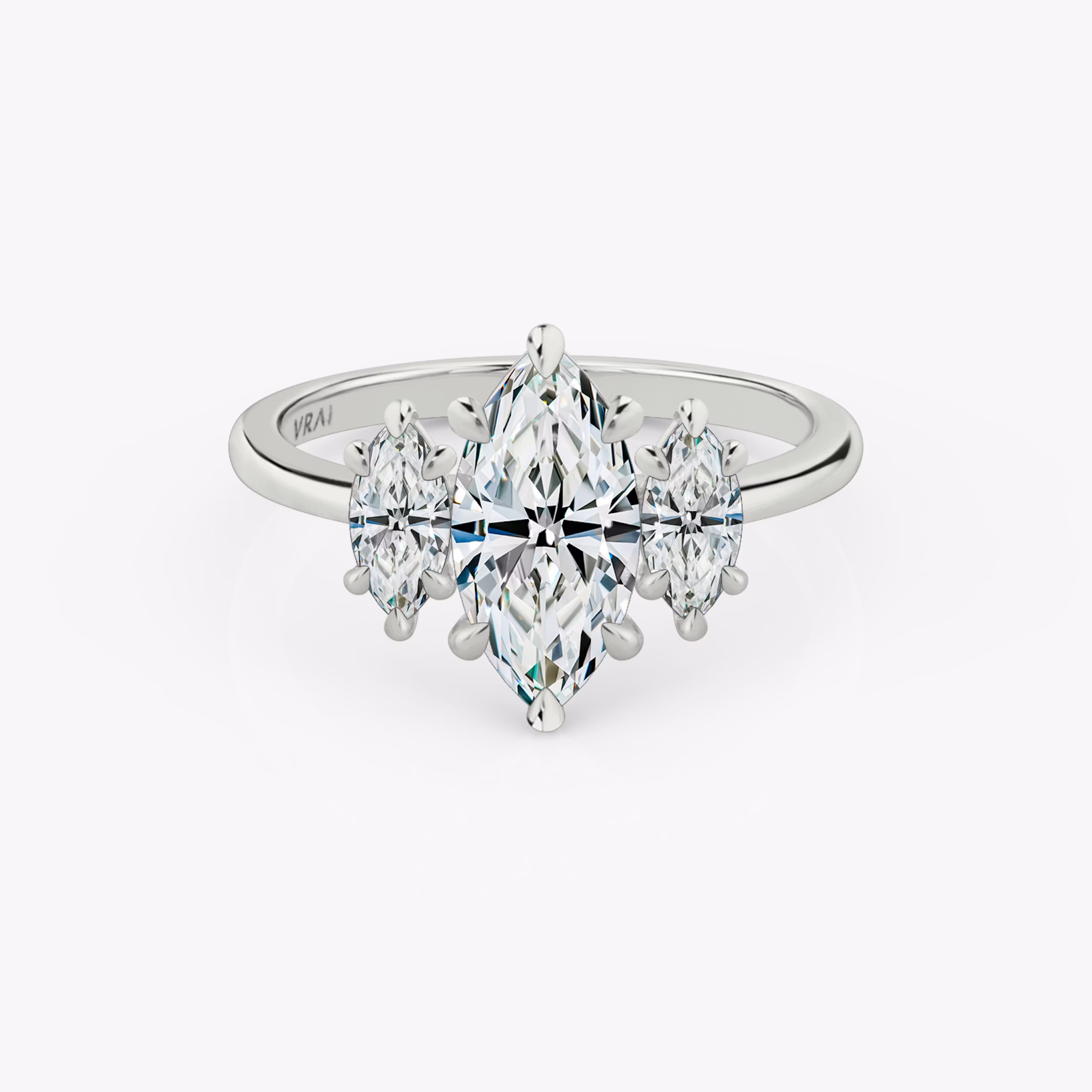 The Three Stone | Marquise | 18k | White Gold | bandAccent: Plain | sideStoneCarat: 0.25ct | sideStoneShape: Marquise | diamondOrientation: vertical | caratWeight: other