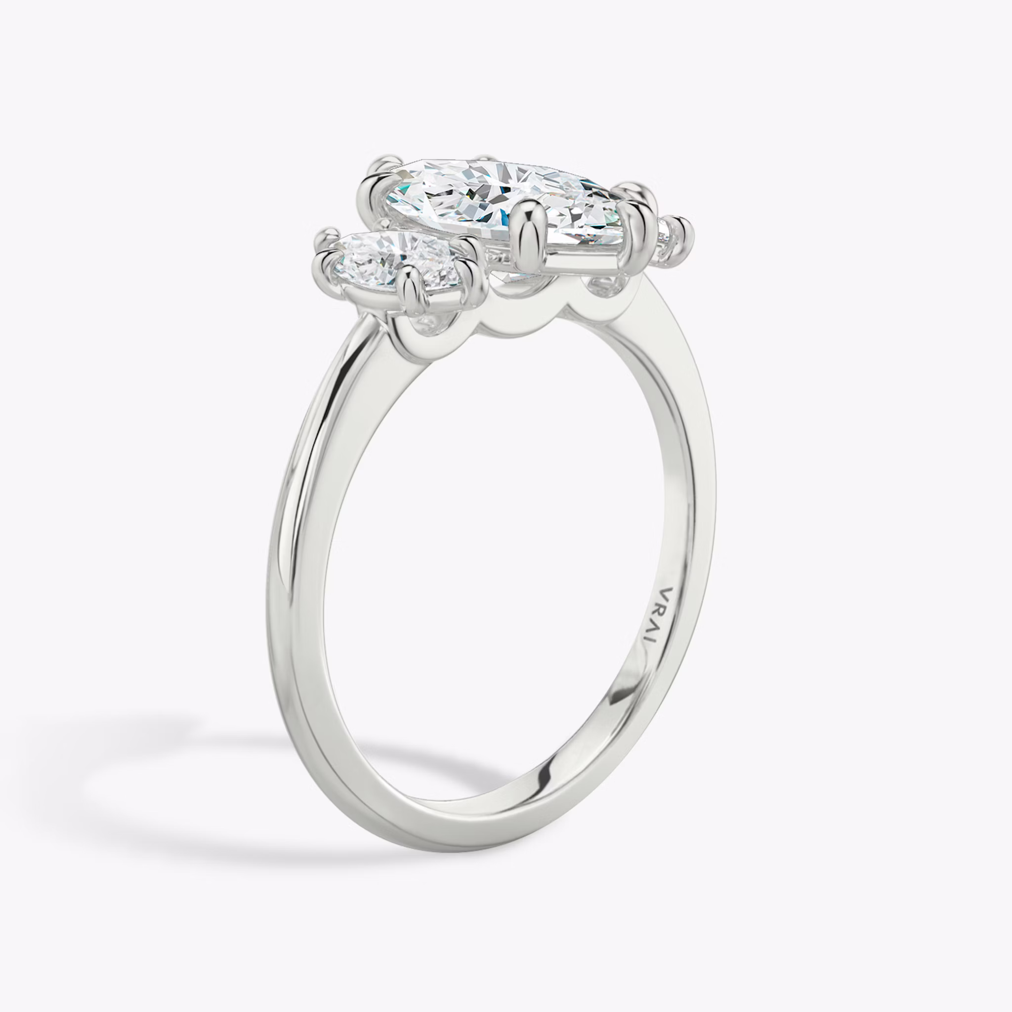 The Three Stone | Marquise | 18k | White Gold | bandAccent: Plain | sideStoneCarat: 0.25ct | sideStoneShape: Marquise | diamondOrientation: vertical | caratWeight: other