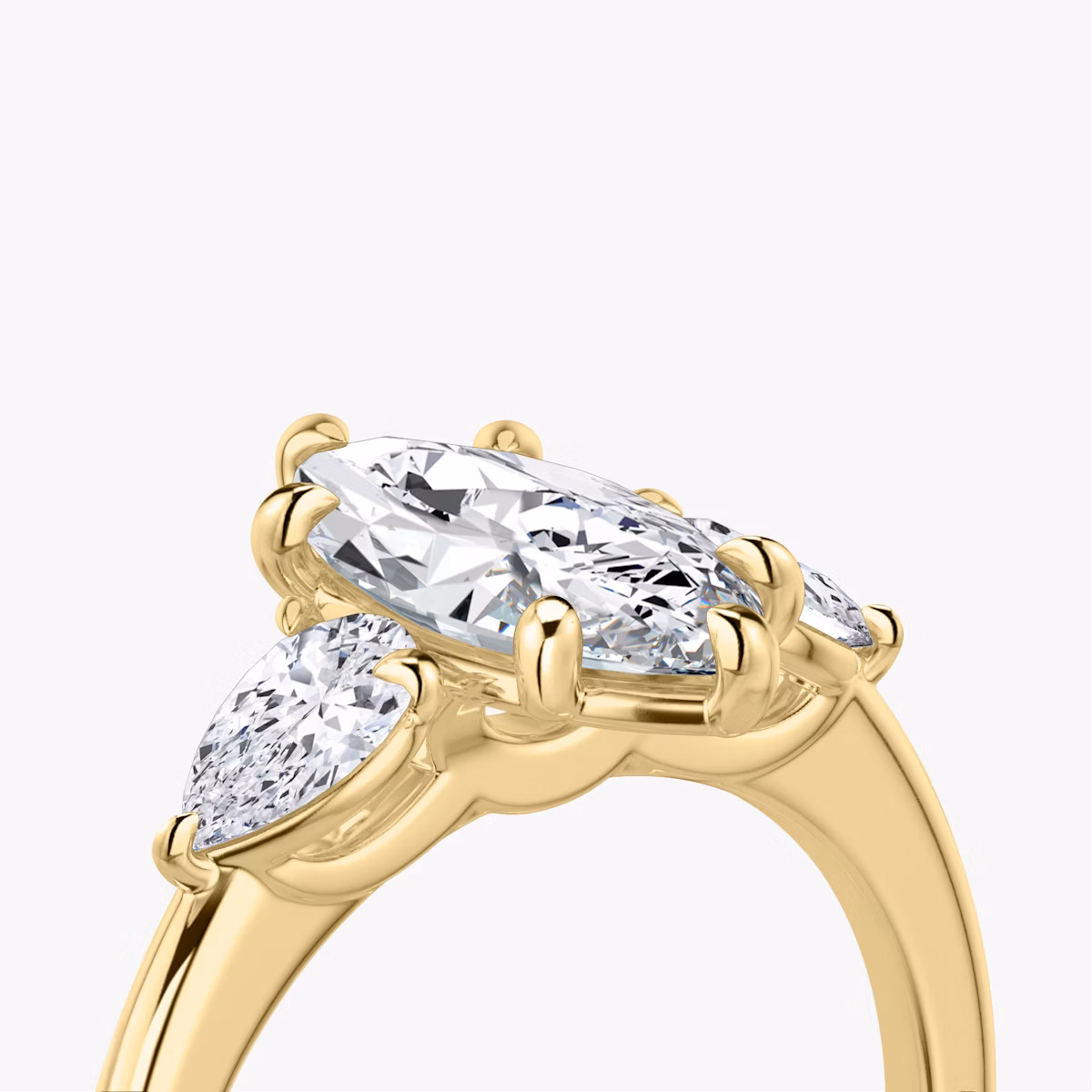 The Three Stone | Marquise | 18k | Yellow Gold | bandAccent: Plain | sideStoneCarat: 0.25ct | sideStoneShape: Pear | diamondOrientation: vertical | caratWeight: other
