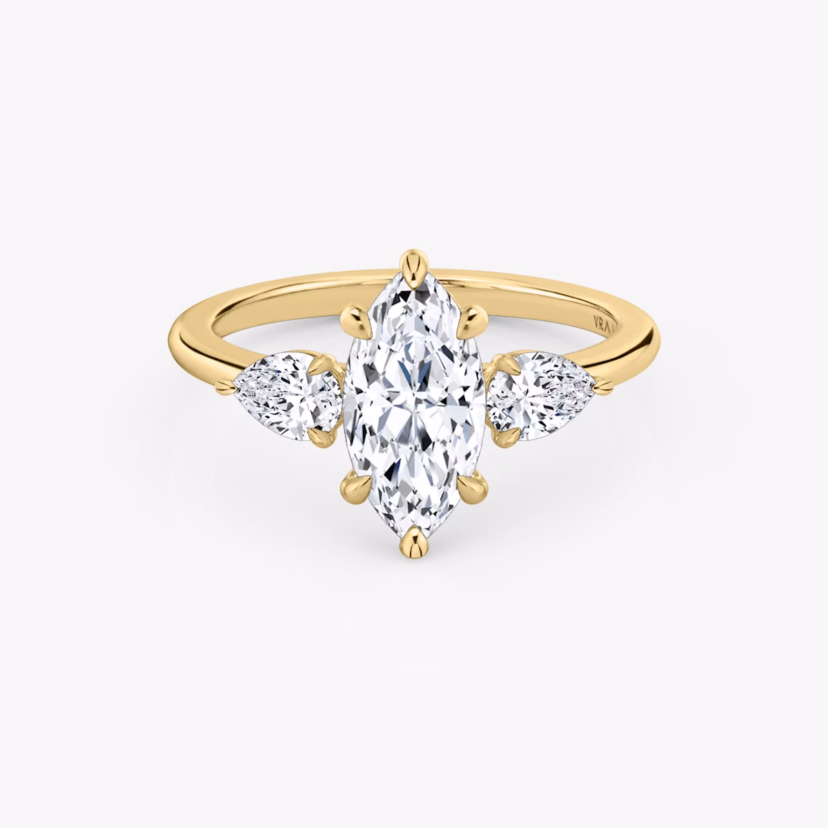 The Three Stone | Marquise | 18k | Yellow Gold | bandAccent: Plain | sideStoneCarat: 0.25ct | sideStoneShape: Pear | diamondOrientation: vertical | caratWeight: other