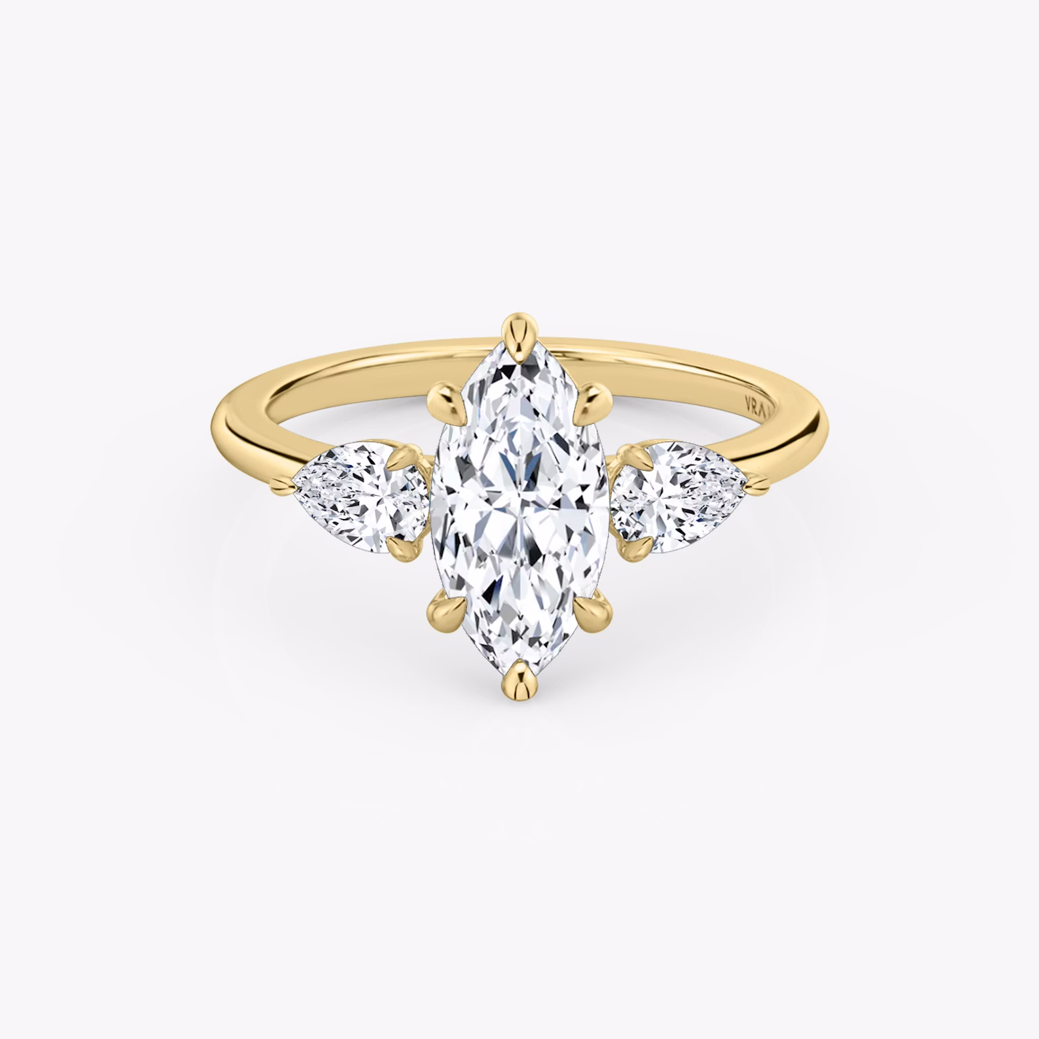 The Three Stone | Marquise | 18k | Yellow Gold | bandAccent: Plain | sideStoneCarat: 0.25ct | sideStoneShape: Pear | diamondOrientation: vertical | caratWeight: other