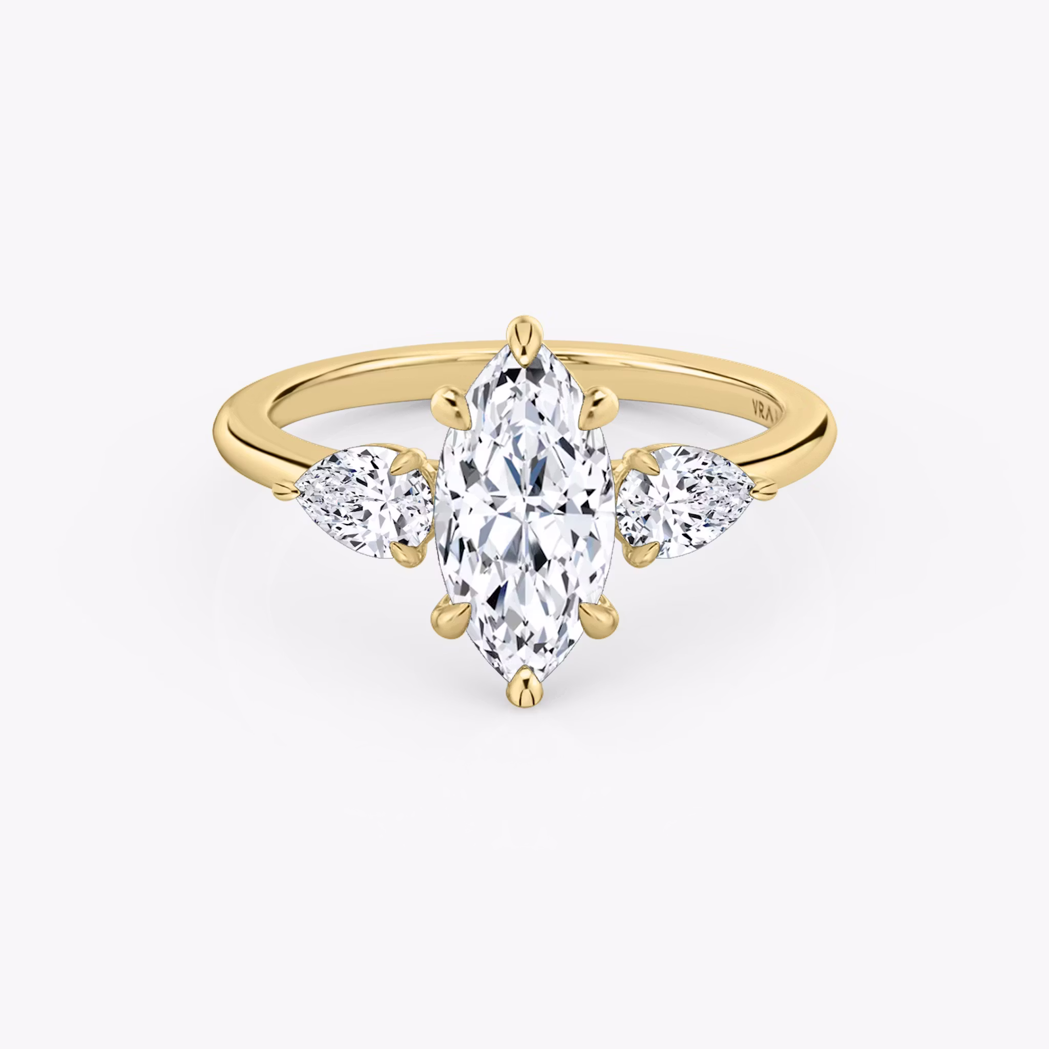 The Three Stone | Marquise | 18k | Yellow Gold | bandAccent: Plain | sideStoneCarat: 0.25ct | sideStoneShape: Pear | diamondOrientation: vertical | caratWeight: other
