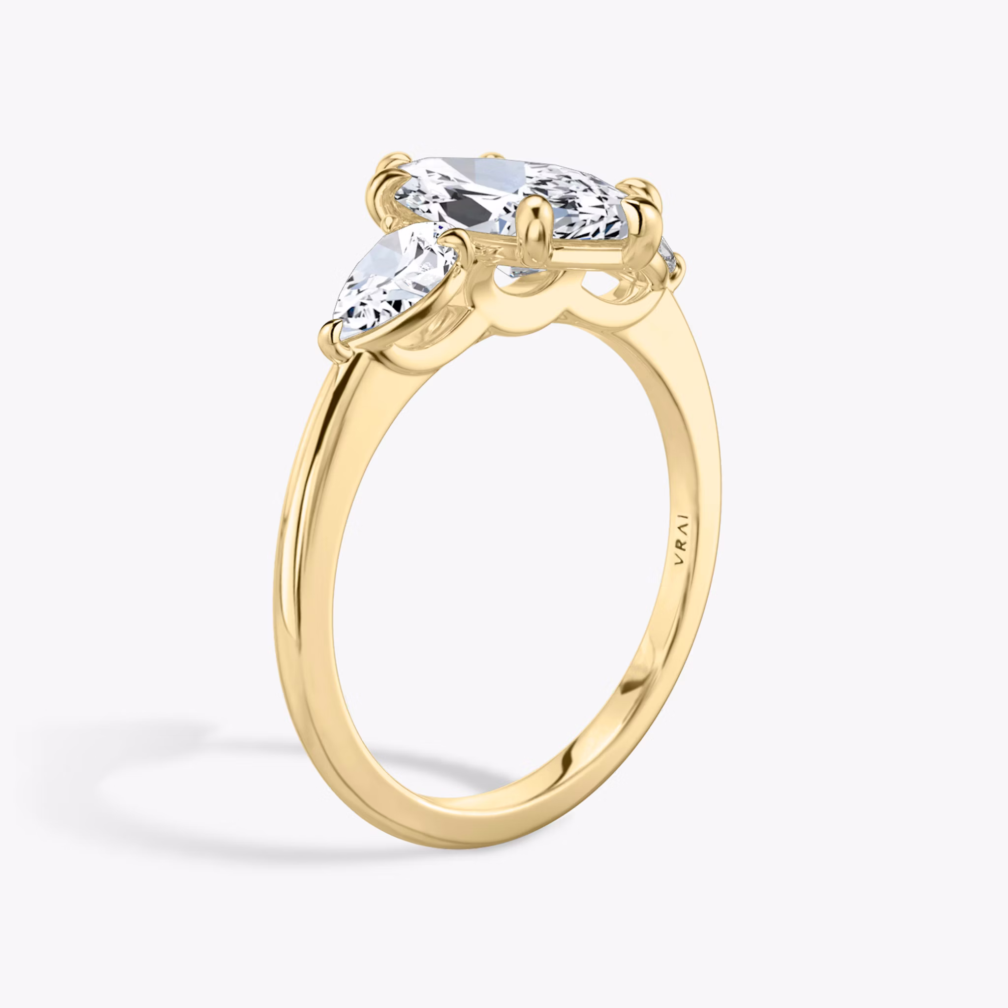 The Three Stone | Marquise | 18k | Yellow Gold | bandAccent: Plain | sideStoneCarat: 0.25ct | sideStoneShape: Pear | diamondOrientation: vertical | caratWeight: other