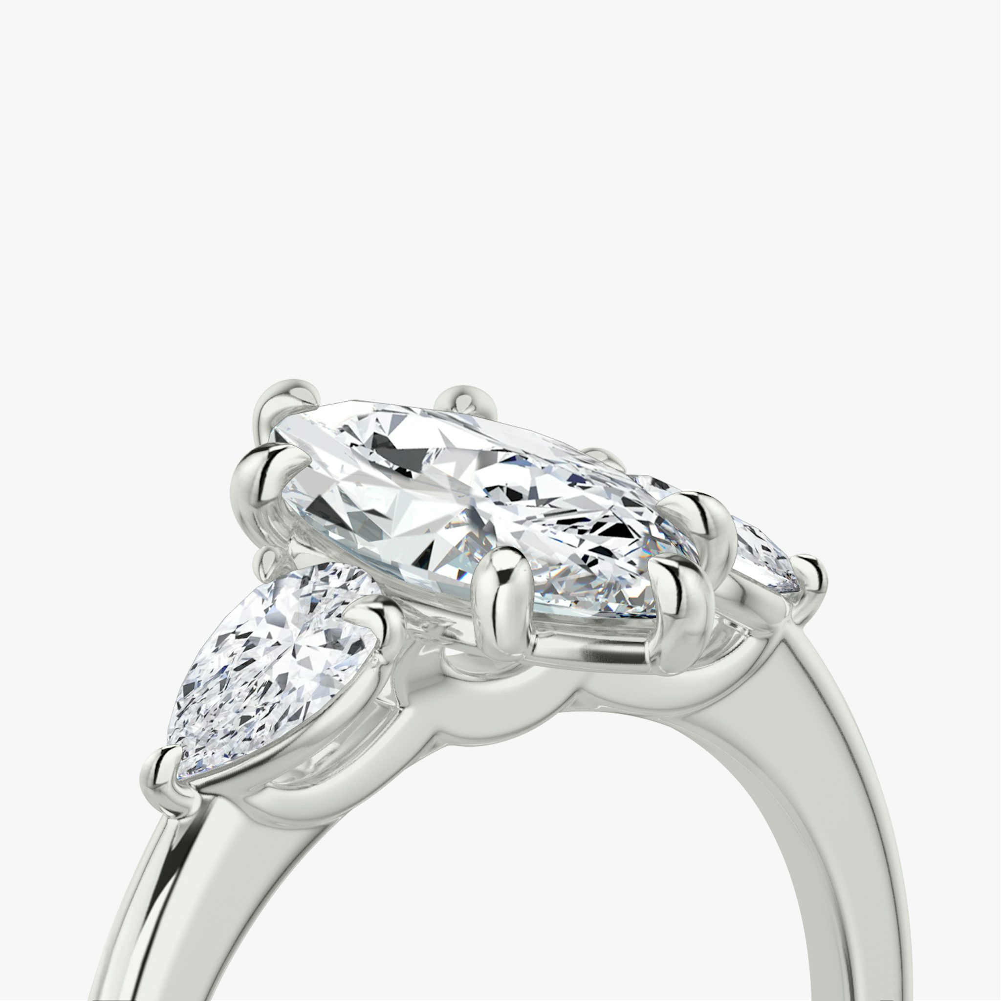 The Three Stone | Marquise | 18k | White Gold | bandAccent: Plain | sideStoneCarat: 0.25ct | sideStoneShape: Pear | diamondOrientation: vertical | caratWeight: other