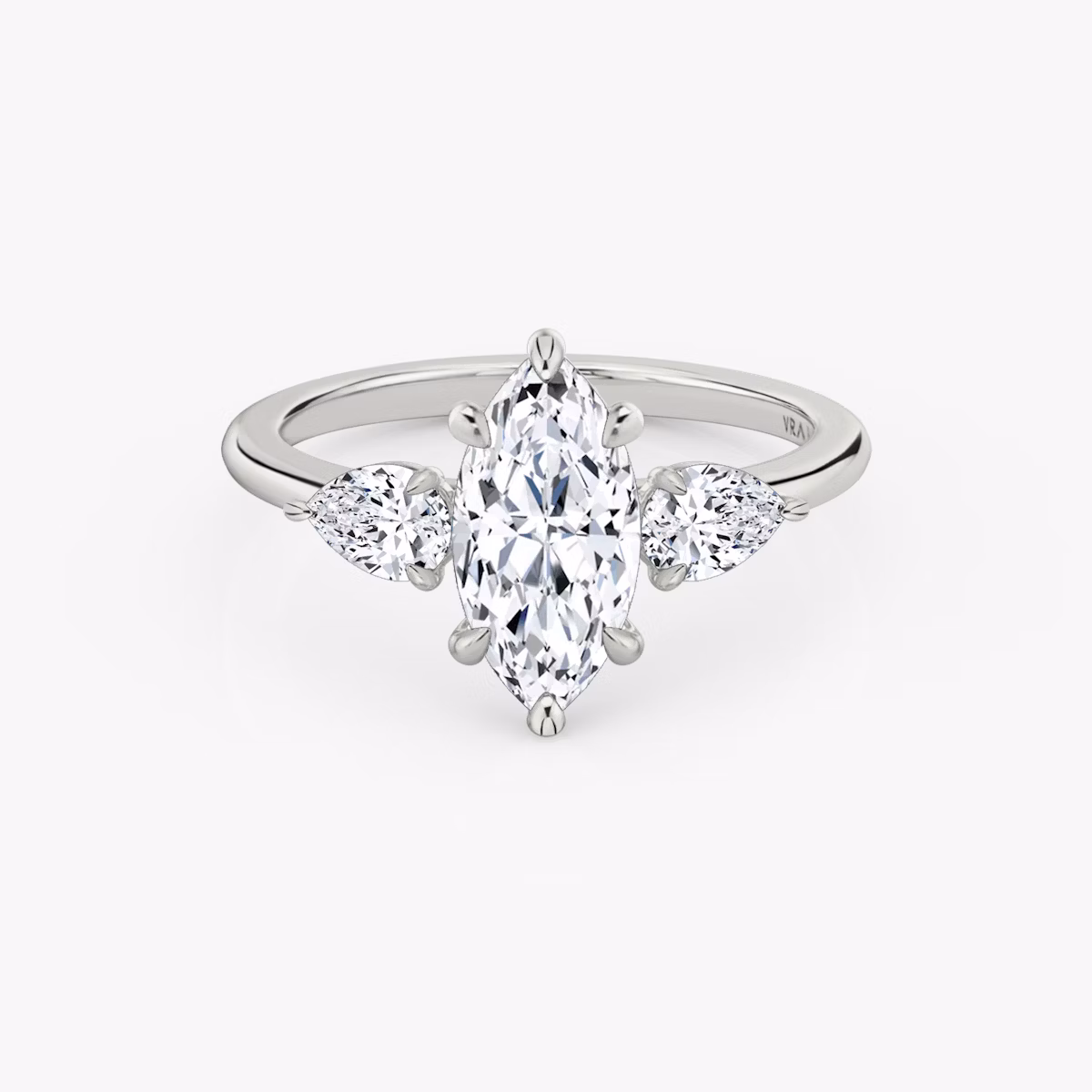 The Three Stone | Marquise | Platinum | bandAccent: Plain | sideStoneCarat: 0.25ct | sideStoneShape: Pear | diamondOrientation: vertical | caratWeight: other