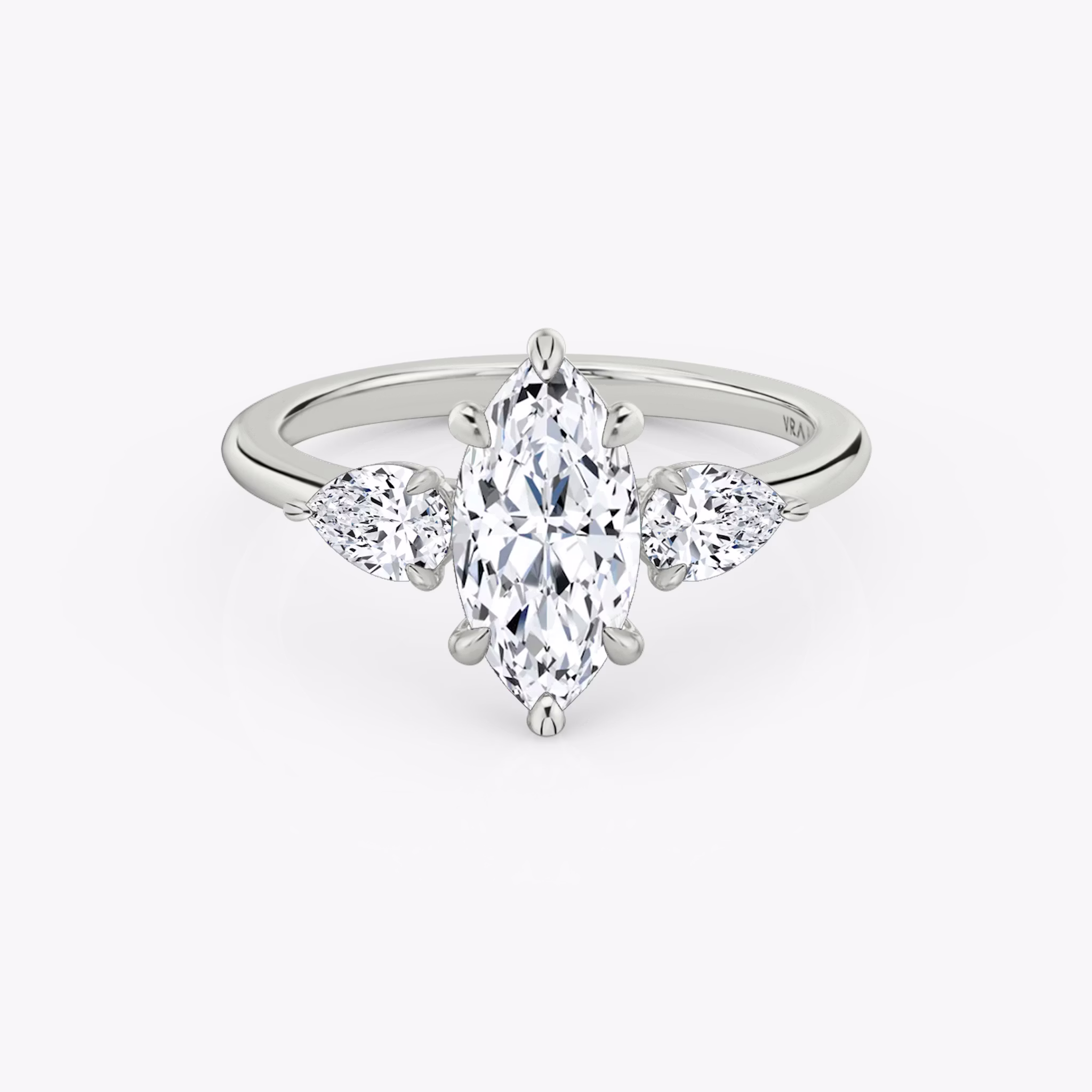 The Three Stone | Marquise | 18k | White Gold | bandAccent: Plain | sideStoneCarat: 0.25ct | sideStoneShape: Pear | diamondOrientation: vertical | caratWeight: other