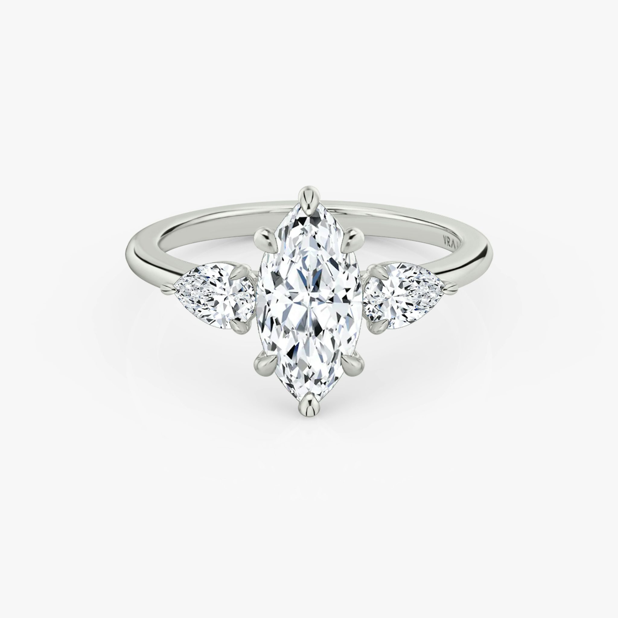 The Three Stone | Marquise | 18k | White Gold | bandAccent: Plain | sideStoneCarat: 0.25ct | sideStoneShape: Pear | diamondOrientation: vertical | caratWeight: other