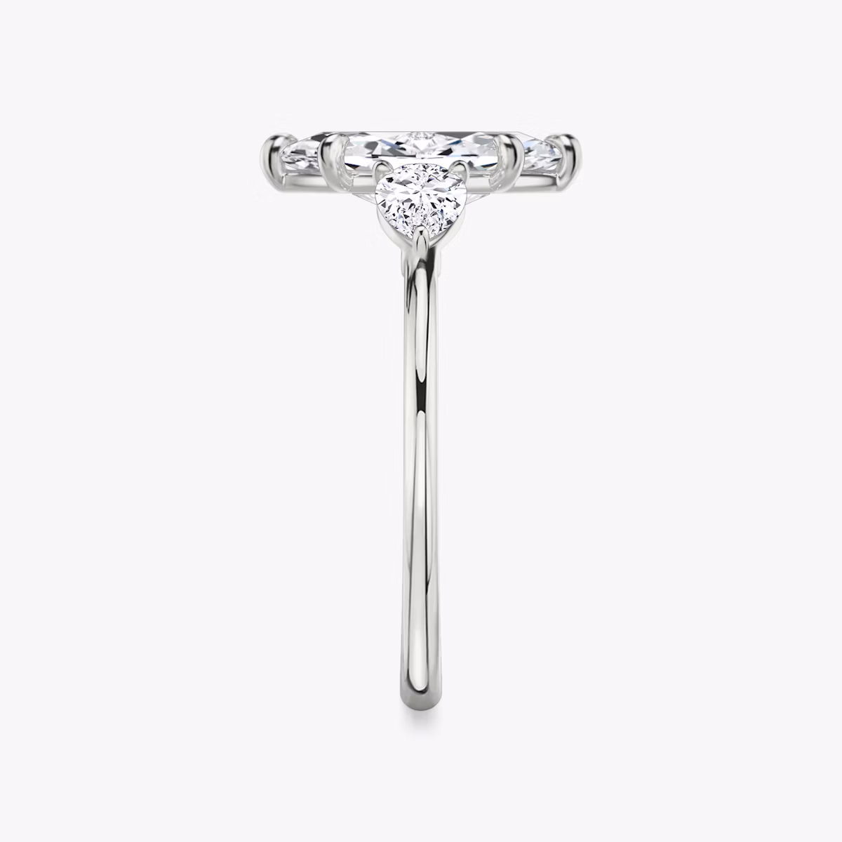 The Three Stone | Marquise | Platinum | bandAccent: Plain | sideStoneCarat: 0.25ct | sideStoneShape: Pear | diamondOrientation: vertical | caratWeight: other