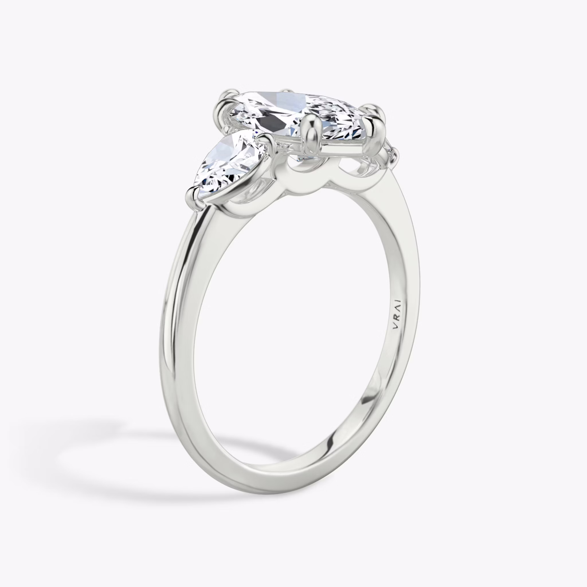 The Three Stone | Marquise | 18k | White Gold | bandAccent: Plain | sideStoneCarat: 0.25ct | sideStoneShape: Pear | diamondOrientation: vertical | caratWeight: other