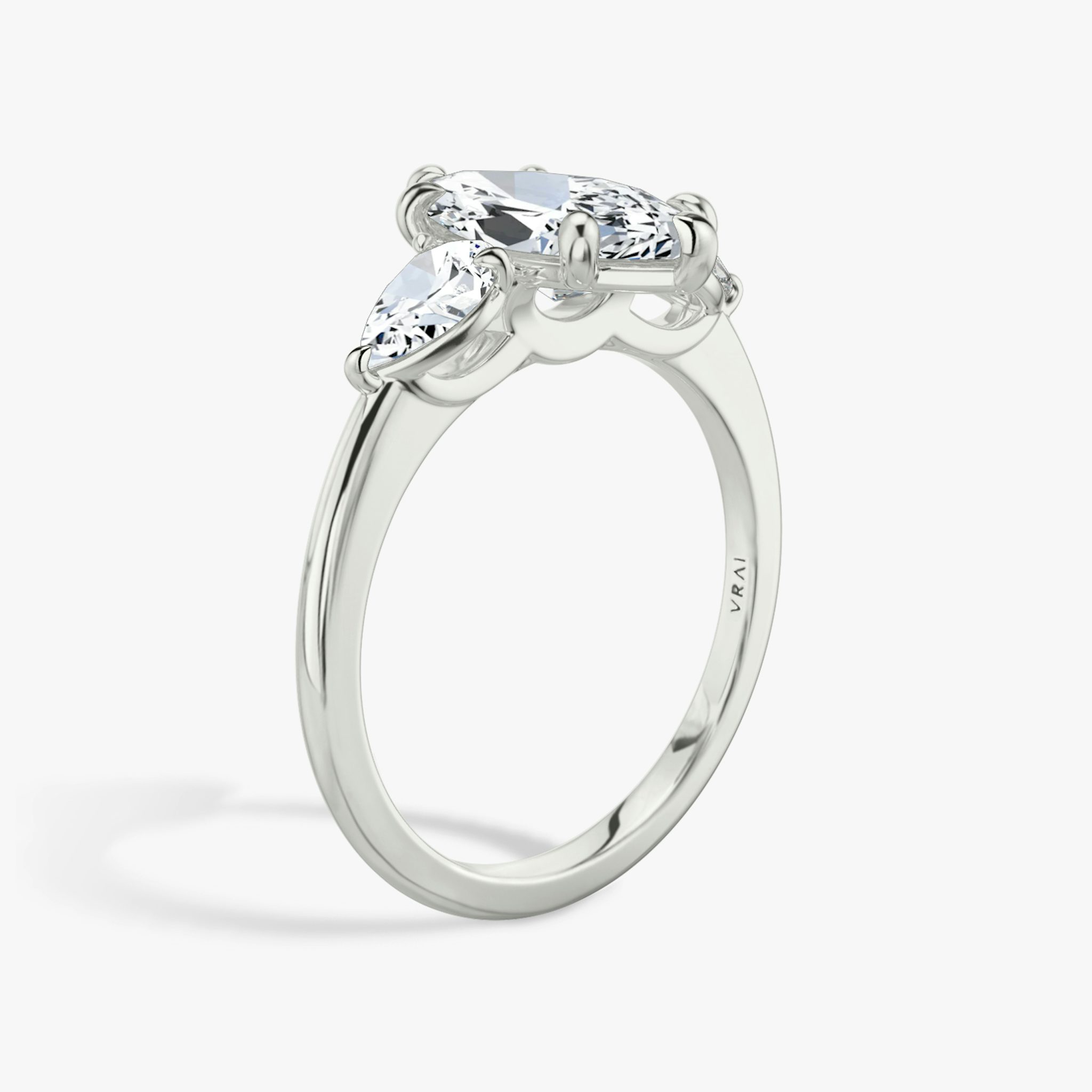 The Three Stone | Marquise | 18k | White Gold | bandAccent: Plain | sideStoneCarat: 0.25ct | sideStoneShape: Pear | diamondOrientation: vertical | caratWeight: other