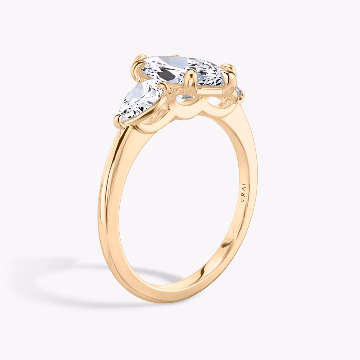 The Three Stone | Marquise | 14k | Rose Gold | bandAccent: Plain | sideStoneCarat: 0.25ct | sideStoneShape: Pear | diamondOrientation: vertical | caratWeight: other
