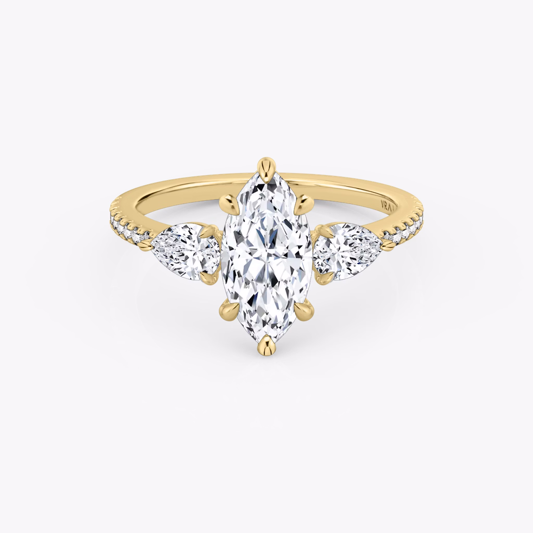 The Three Stone | Marquise | 18k | Yellow Gold | bandAccent: Pavé | sideStoneCarat: 0.25ct | sideStoneShape: Pear | diamondOrientation: vertical | caratWeight: other