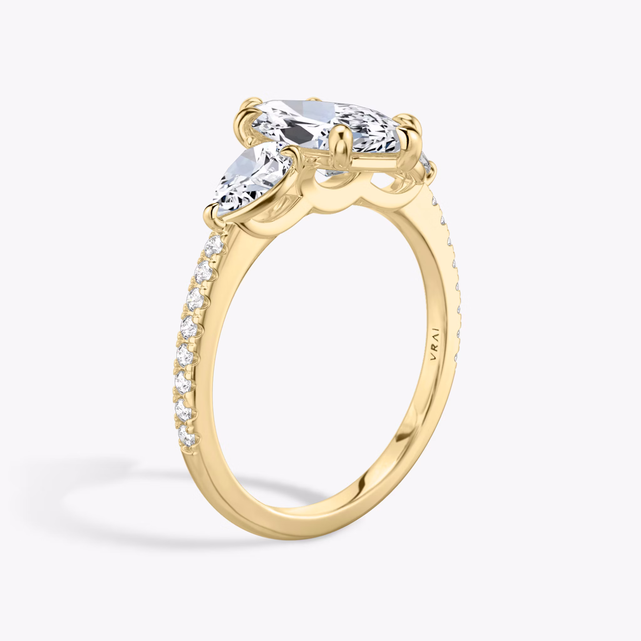 The Three Stone | Marquise | 18k | Yellow Gold | bandAccent: Pavé | sideStoneCarat: 0.25ct | sideStoneShape: Pear | diamondOrientation: vertical | caratWeight: other