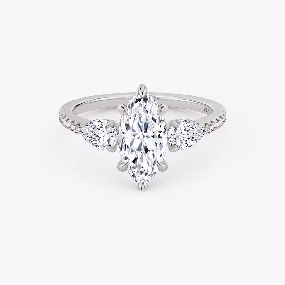 The Three Stone | Marquise | Platinum | bandAccent: Pavé | sideStoneCarat: 0.25ct | sideStoneShape: Pear | diamondOrientation: vertical | caratWeight: other