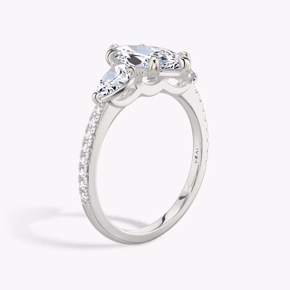 The Three Stone | Marquise | Platinum | bandAccent: Pavé | sideStoneCarat: 0.25ct | sideStoneShape: Pear | diamondOrientation: vertical | caratWeight: other