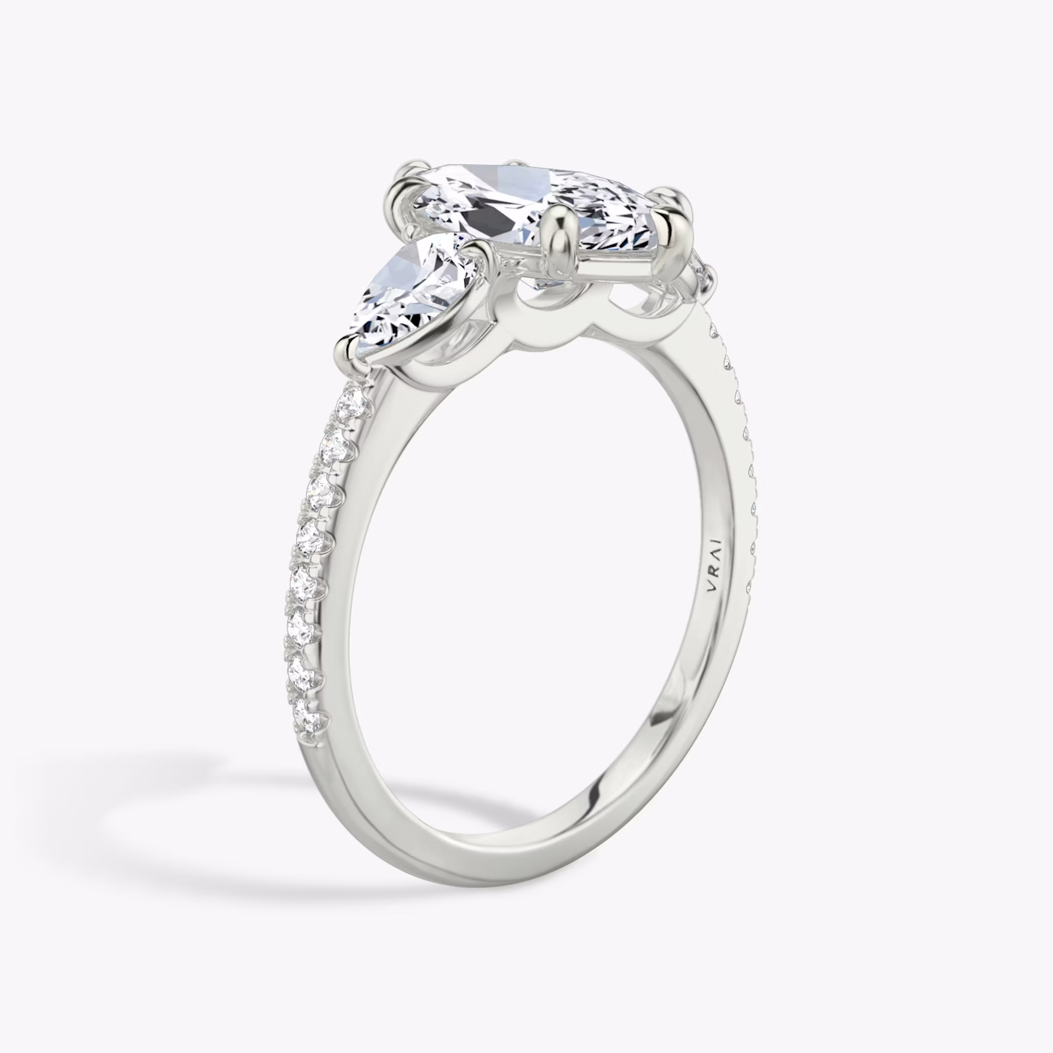 The Three Stone | Marquise | 18k | White Gold | bandAccent: Pavé | sideStoneCarat: 0.25ct | sideStoneShape: Pear | diamondOrientation: vertical | caratWeight: other