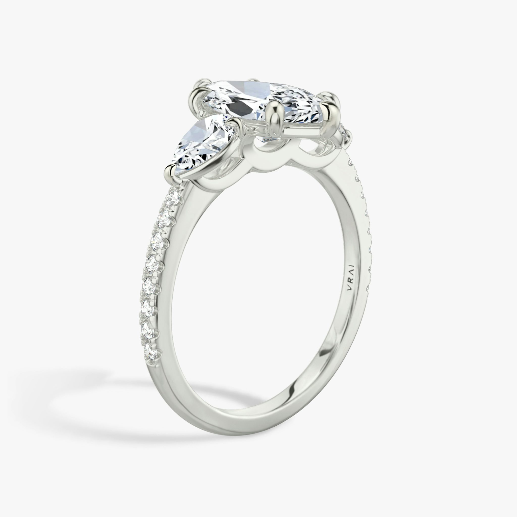 The Three Stone | Marquise | 18k | White Gold | bandAccent: Pavé | sideStoneCarat: 0.25ct | sideStoneShape: Pear | diamondOrientation: vertical | caratWeight: other
