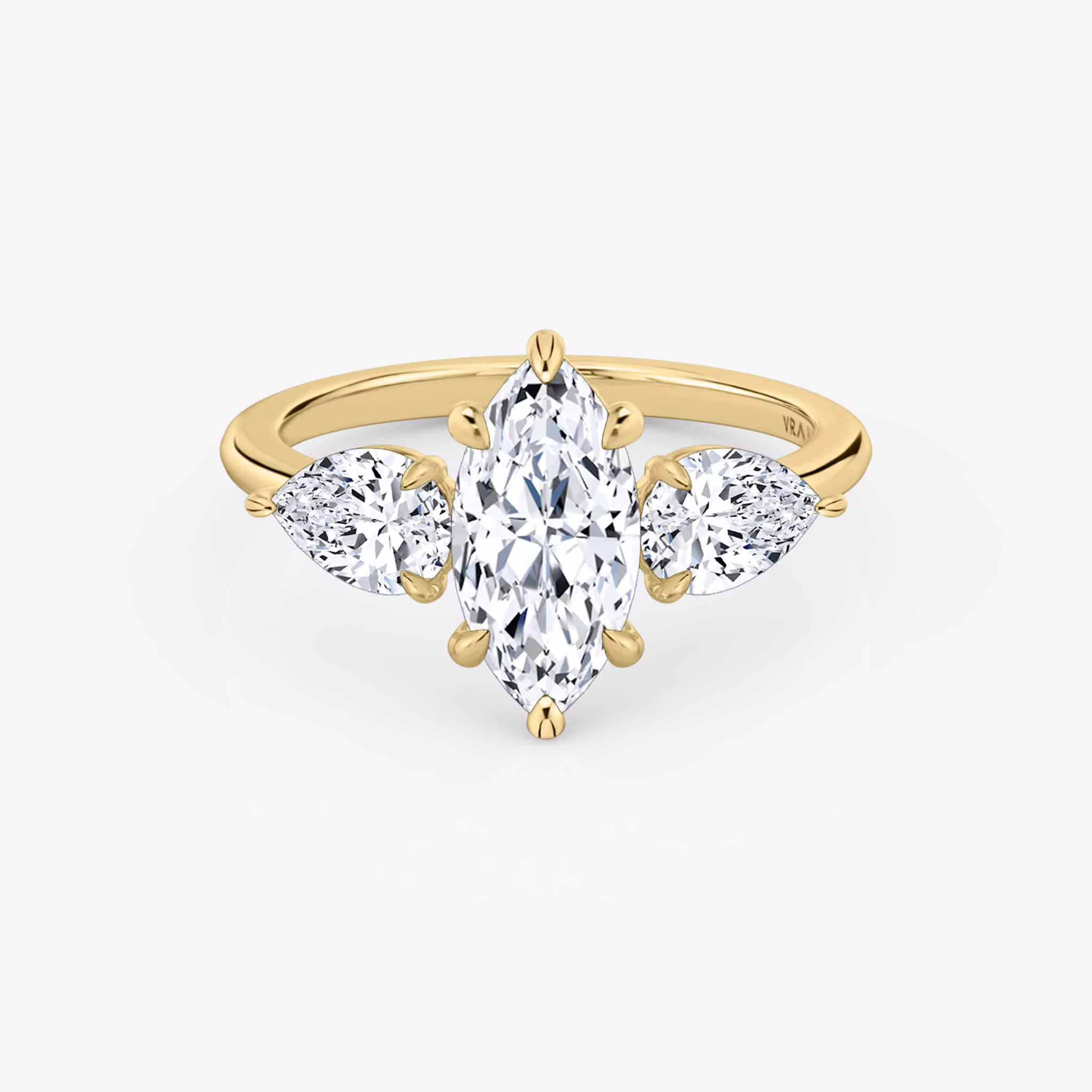 The Three Stone | Marquise | 18k | Yellow Gold | bandAccent: Plain | sideStoneCarat: 0.50ct | sideStoneShape: Pear | diamondOrientation: vertical | caratWeight: other