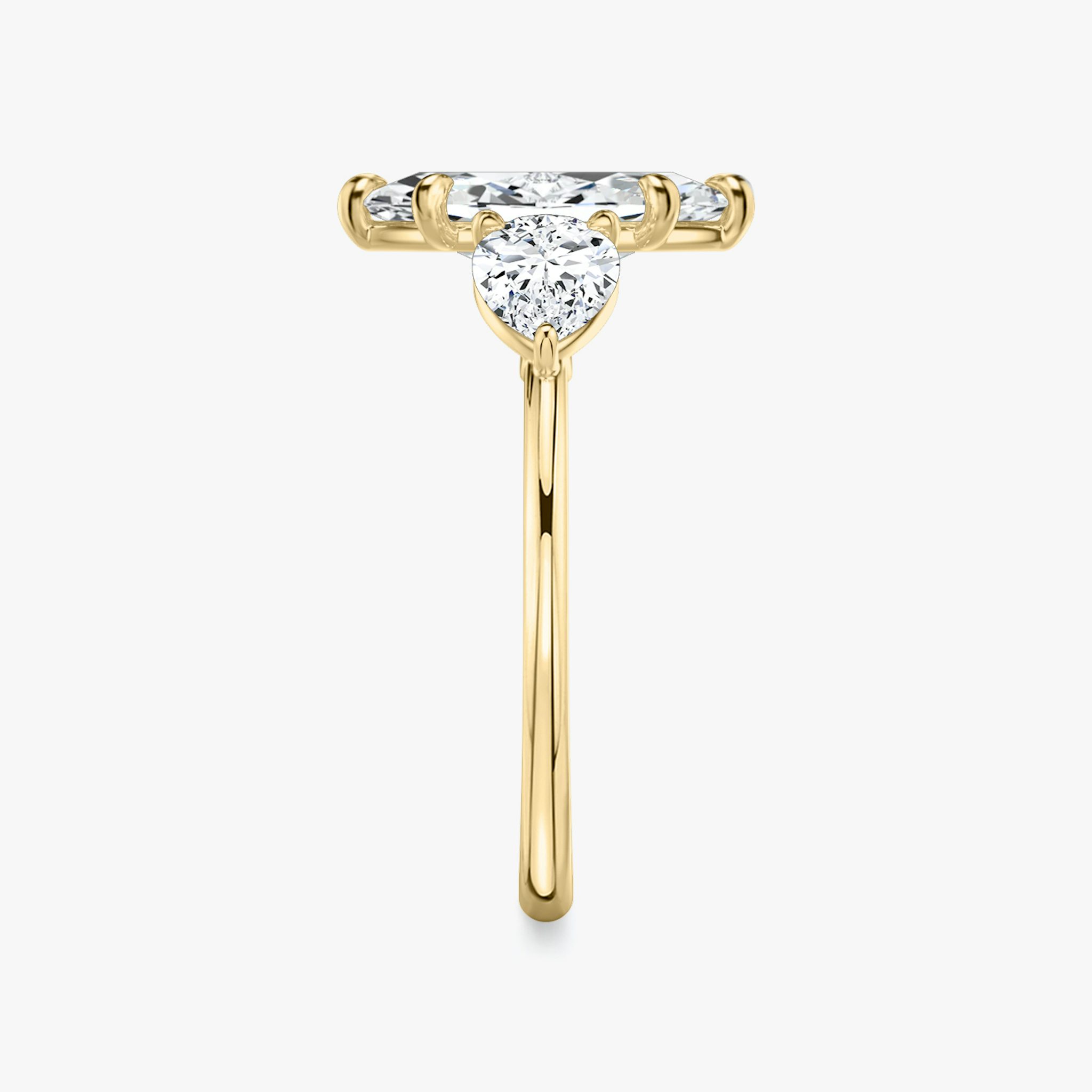 The Three Stone | Marquise | 18k | Yellow Gold | bandAccent: Plain | sideStoneCarat: 0.50ct | sideStoneShape: Pear | diamondOrientation: vertical | caratWeight: other