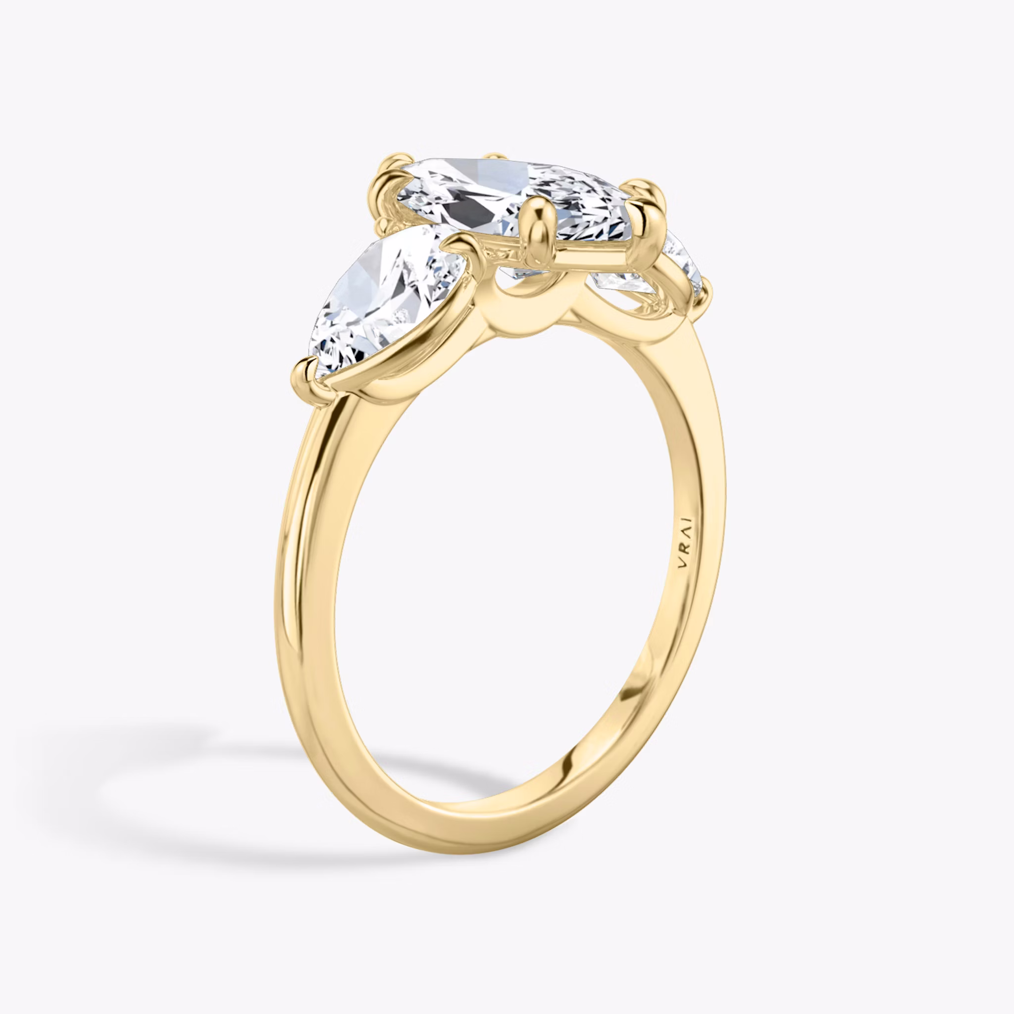 The Three Stone | Marquise | 18k | Yellow Gold | bandAccent: Plain | sideStoneCarat: 0.50ct | sideStoneShape: Pear | diamondOrientation: vertical | caratWeight: other